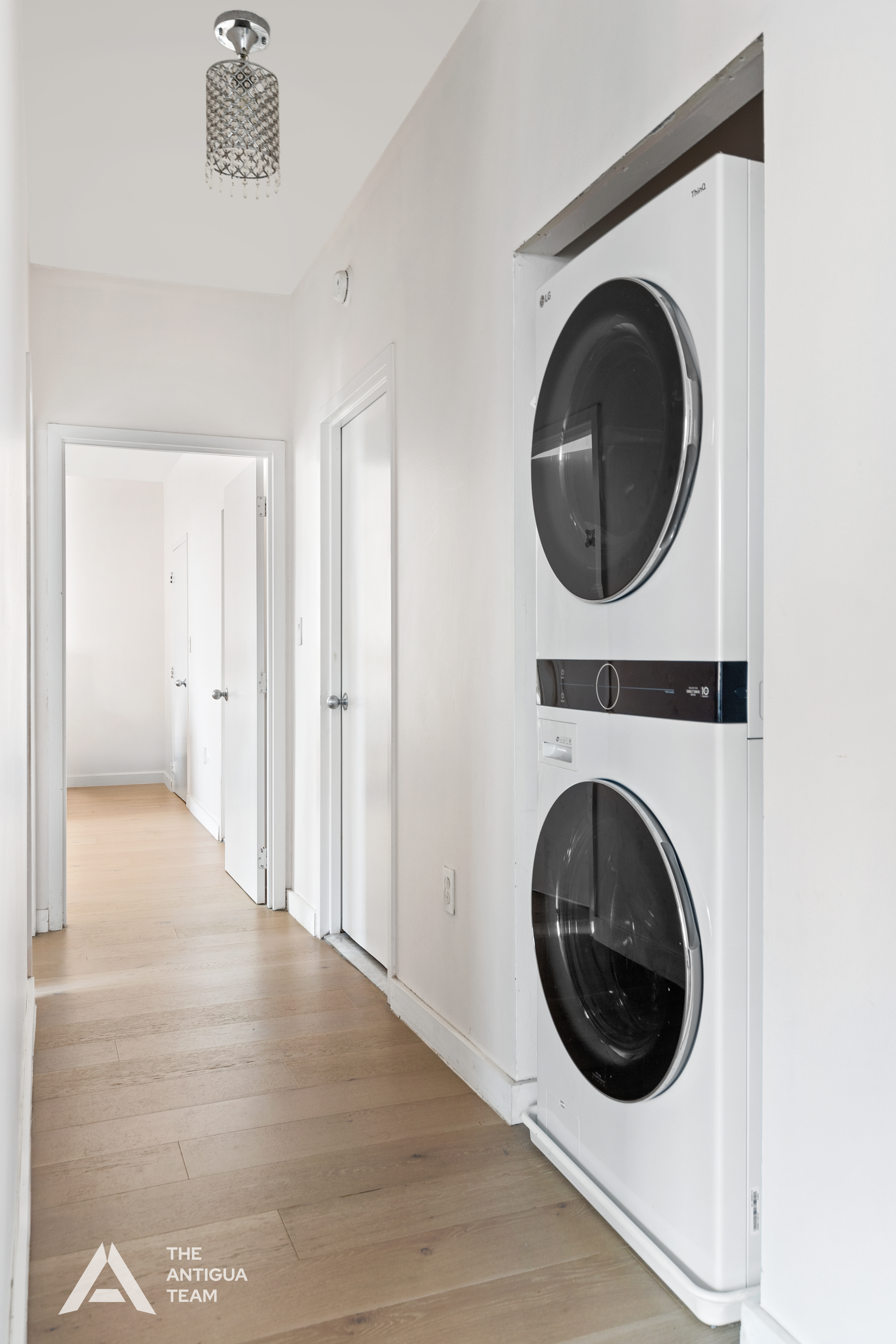 60 Oceana Drive West, Unit 10A Brooklyn, NY 11235 - Photo 9 of 16 a view of a hallway with washer and dryer