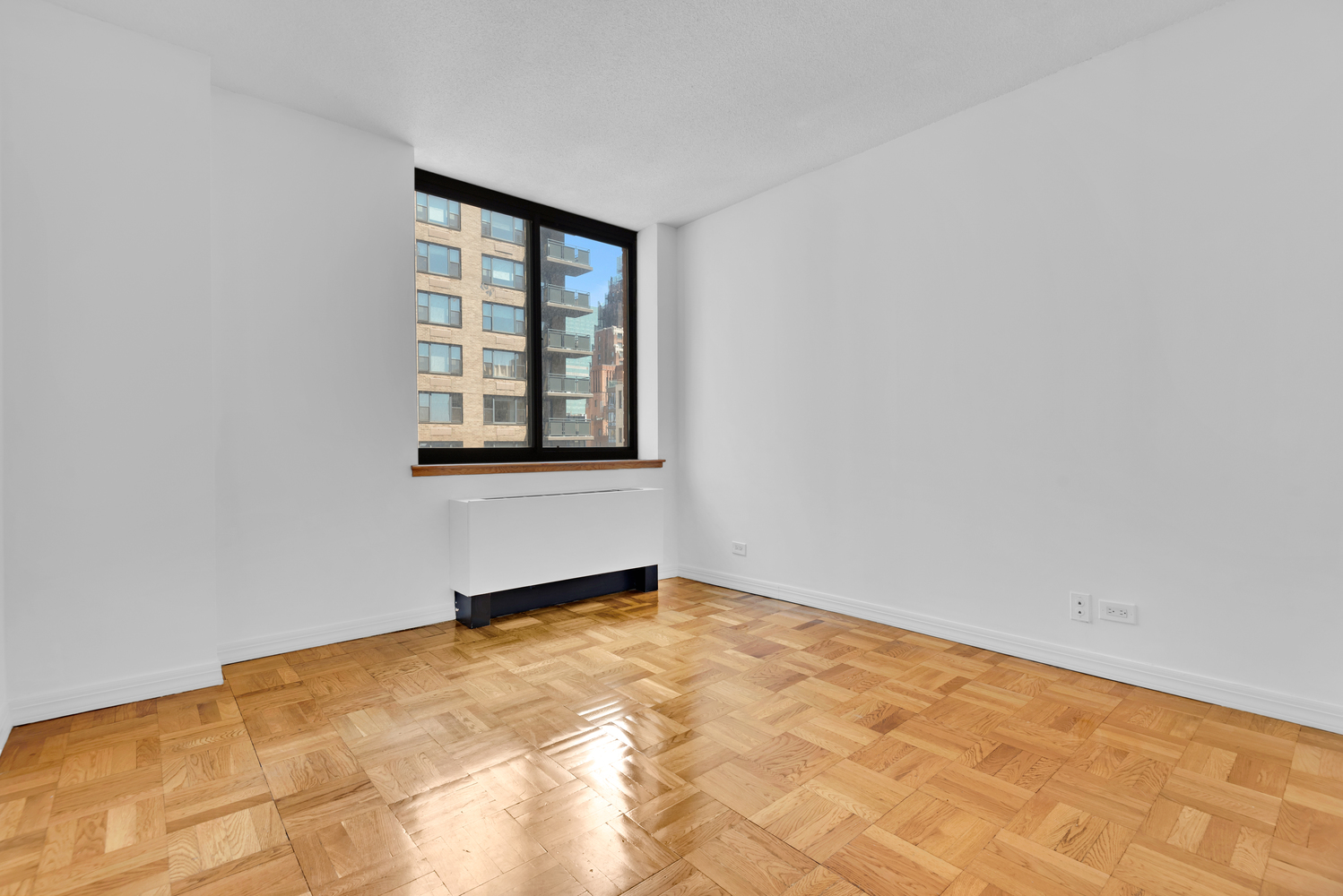 250 East 40th Street, Unit 22B Manhattan, NY 10016 - Photo 6 of 13 an empty room with a window