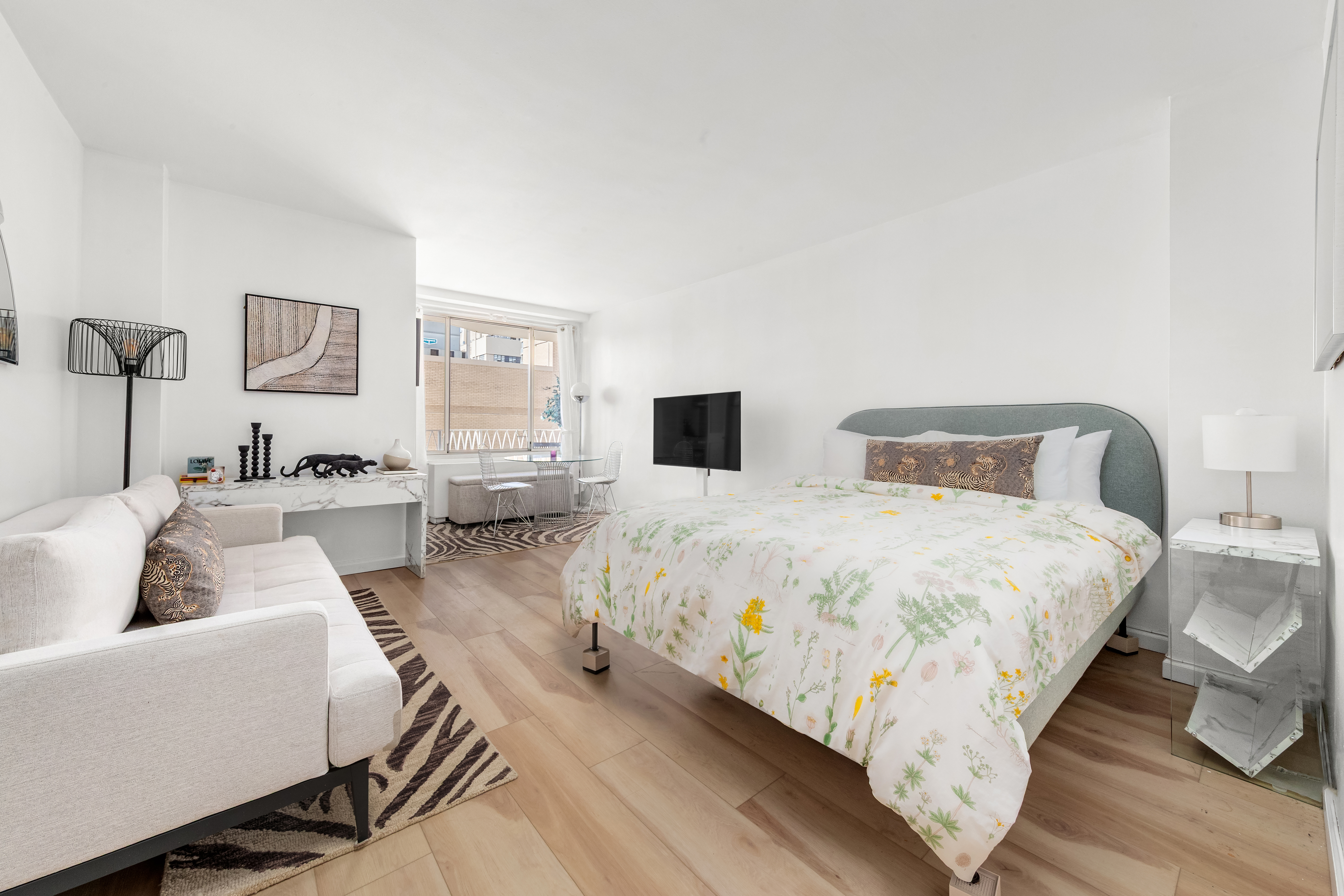 a bed room with two bed and a couch