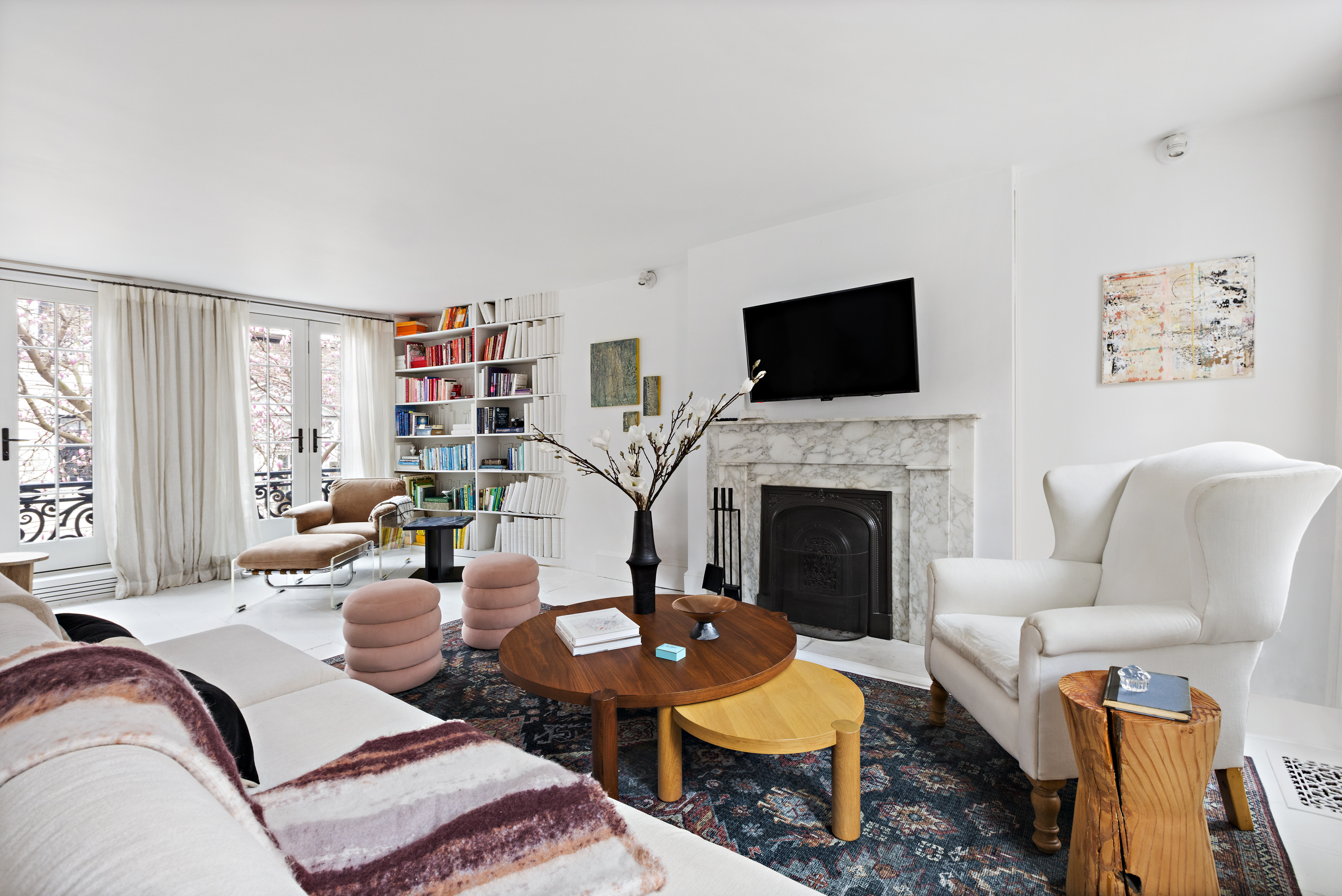 49 Barrow Street Manhattan, NY 10014 - Photo 2 of 25 a living room with furniture a flat screen tv and a fireplace