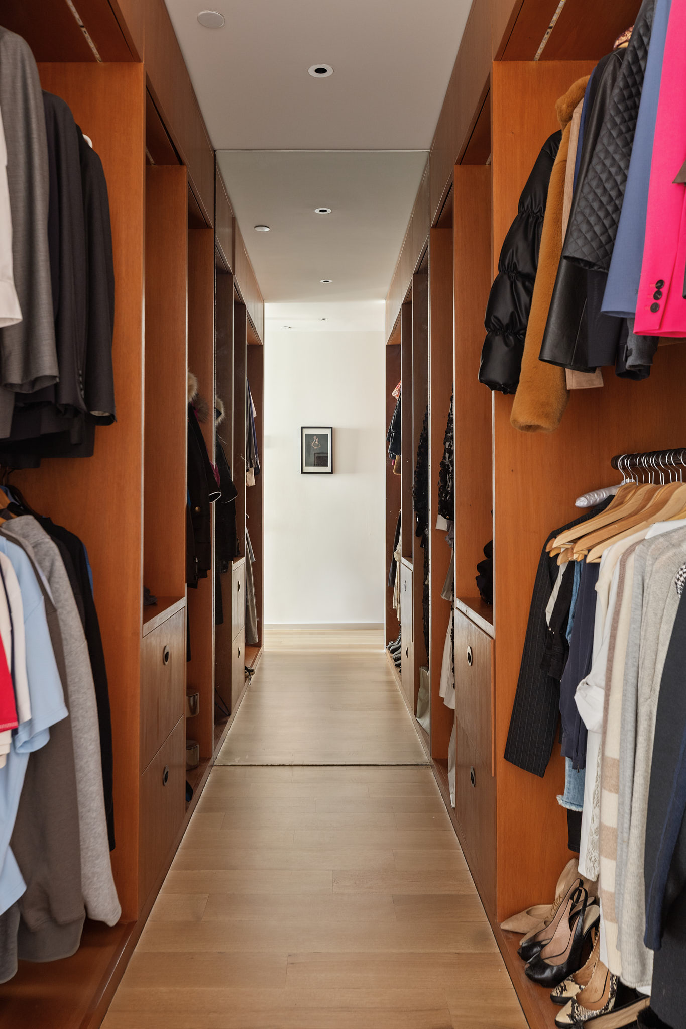 101 Wooster Street, Unit 3F/4F Manhattan, NY 10012 - Photo 12 of 24 a view of walk in closet with clothes and shoes