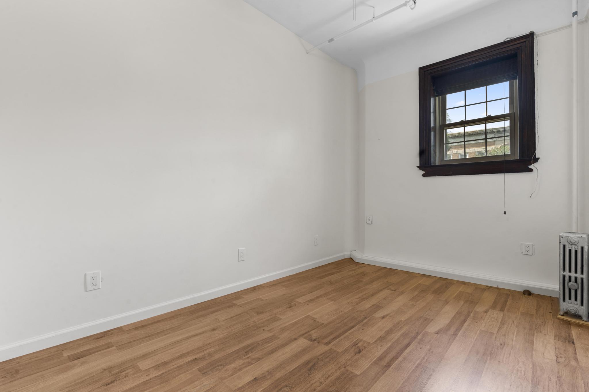 880 Park Place, Unit 2 Brooklyn, NY 11216 - Photo 9 of 12 wooden floor in an empty room