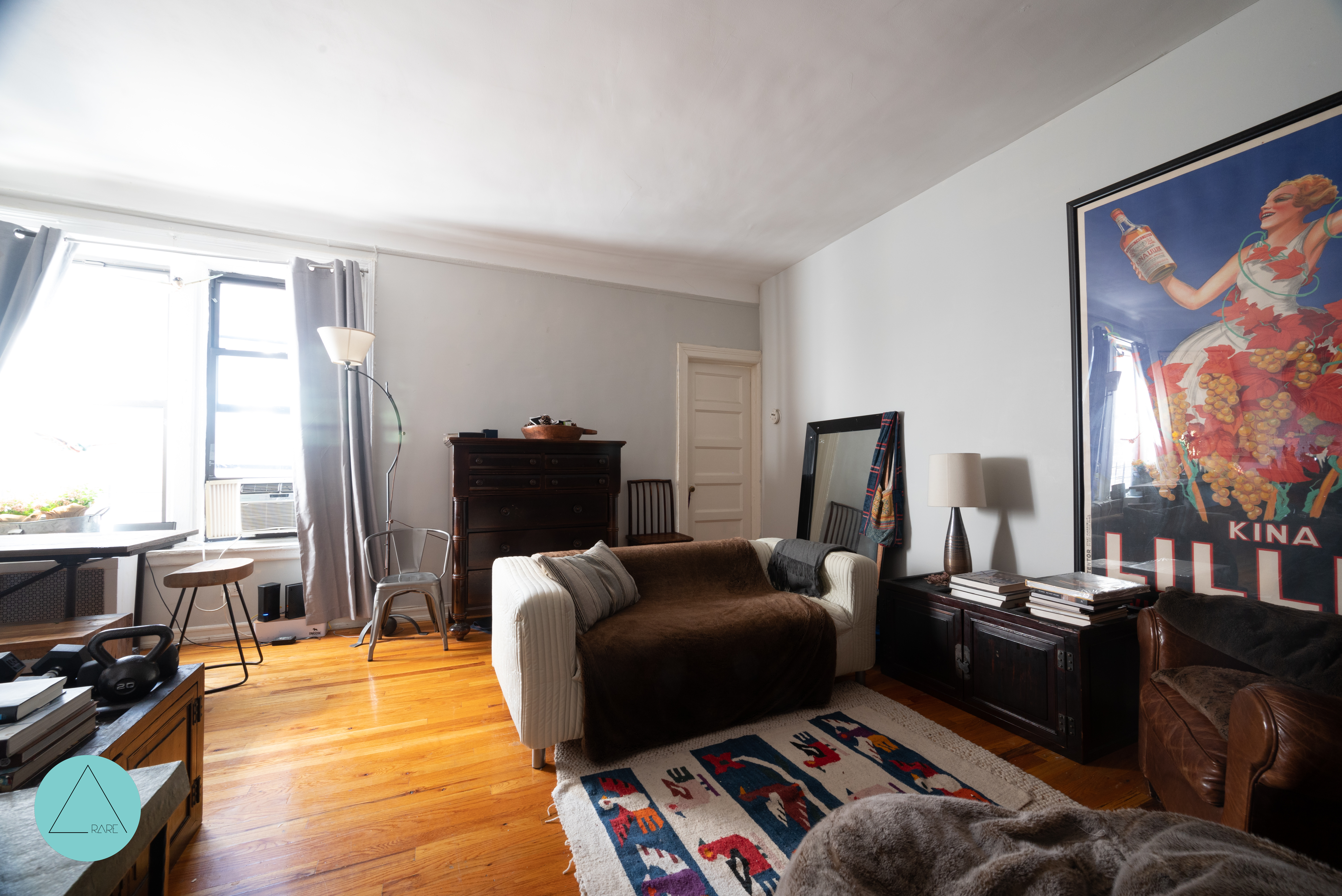 862 West End Avenue, Unit 4R Manhattan, NY 10025 - Photo 2 of 6 a living room with furniture and a flat screen tv