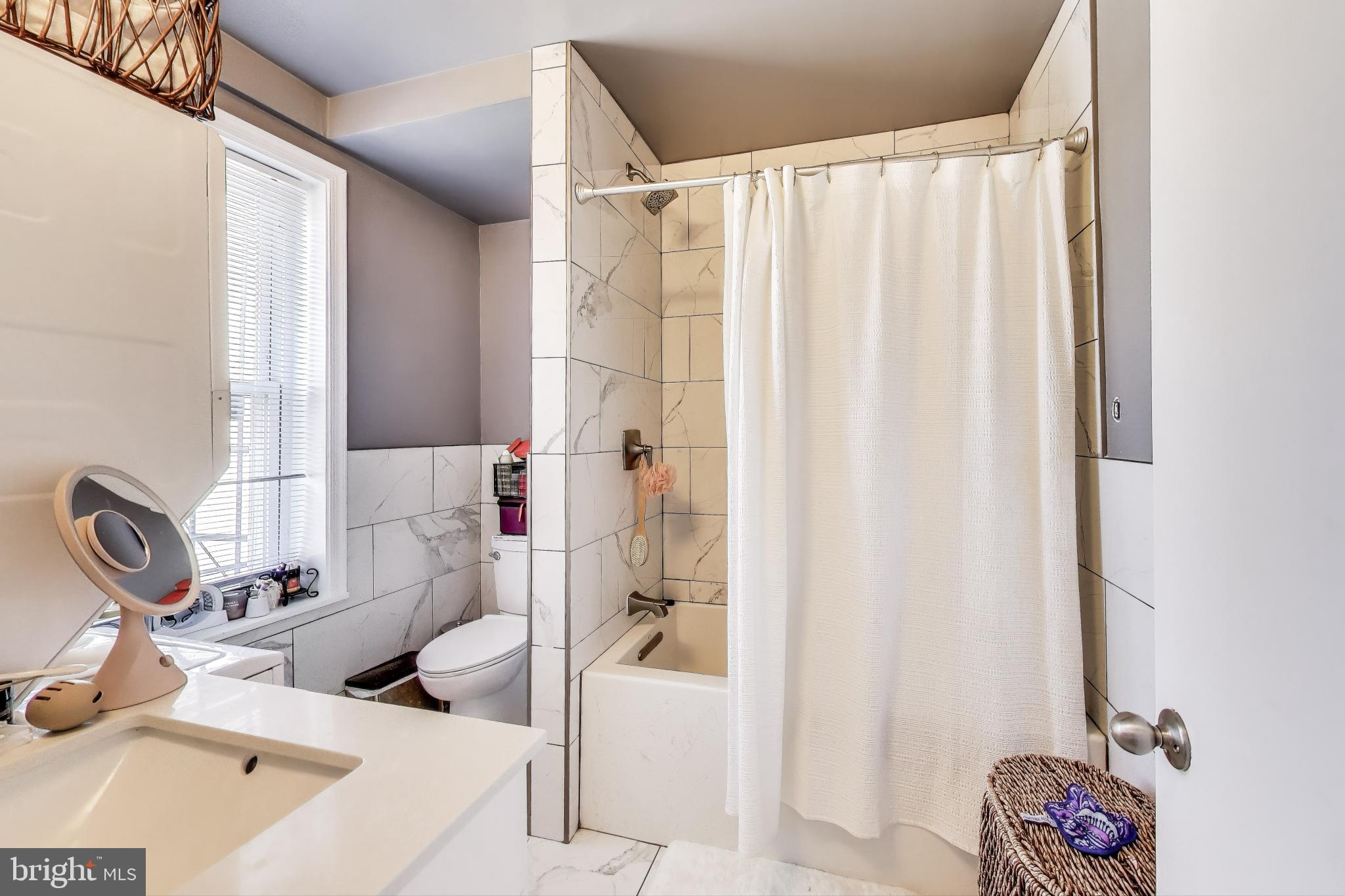 1317 Corcoran Street Northwest Washington, DC 20009 - Photo 26 of 47 a bathroom with a sink and a tub