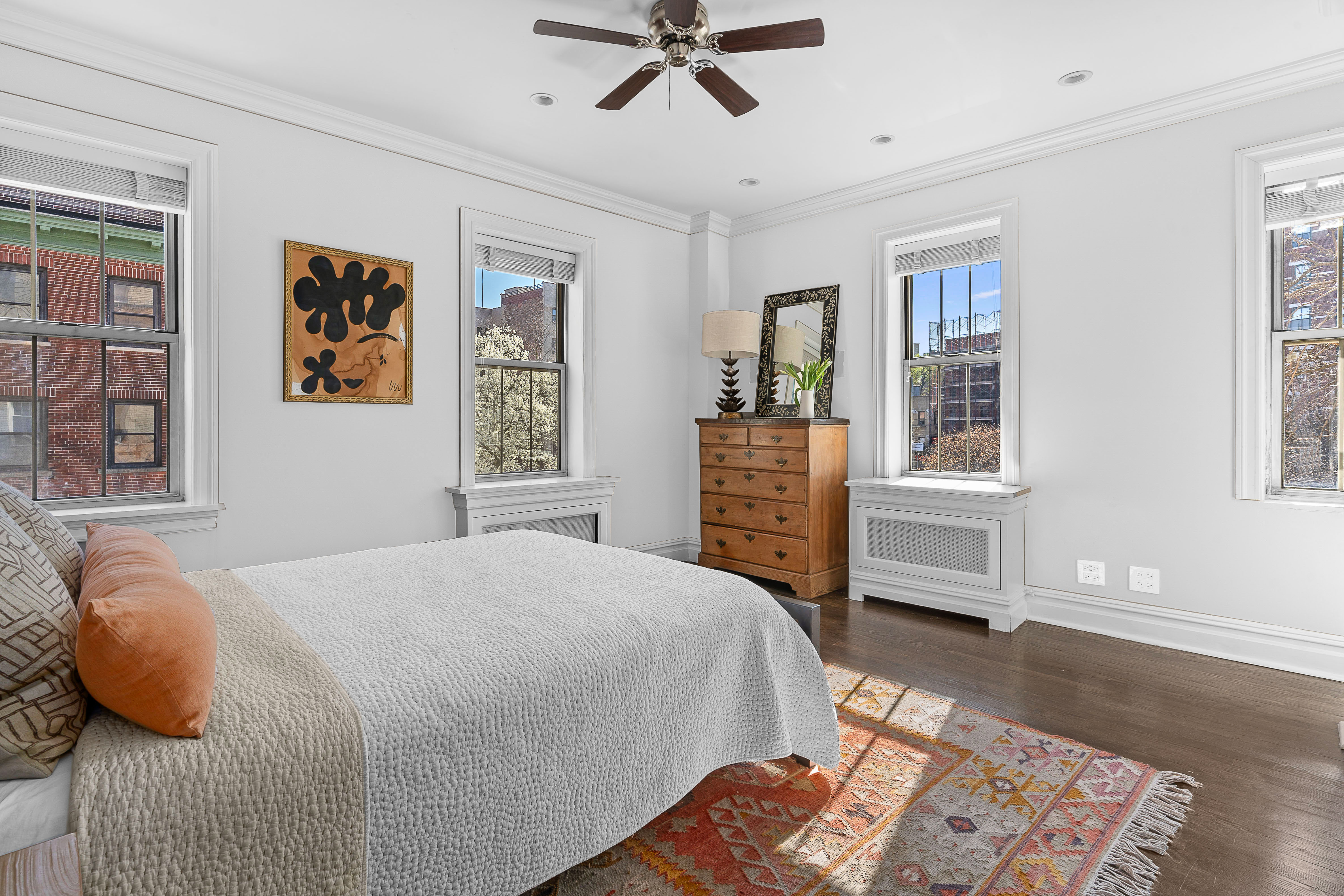 75 Bank Street, Unit 3K Manhattan, NY 10014 - Photo 6 of 11 a bedroom with a bed and wooden floor