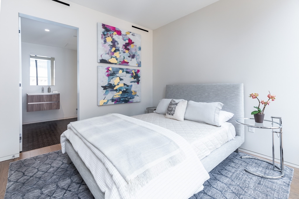 10 Farnsworth Street, Unit 3A Boston, MA 02210 - Photo 22 of 31 a bedroom with a bed and painting on the wall