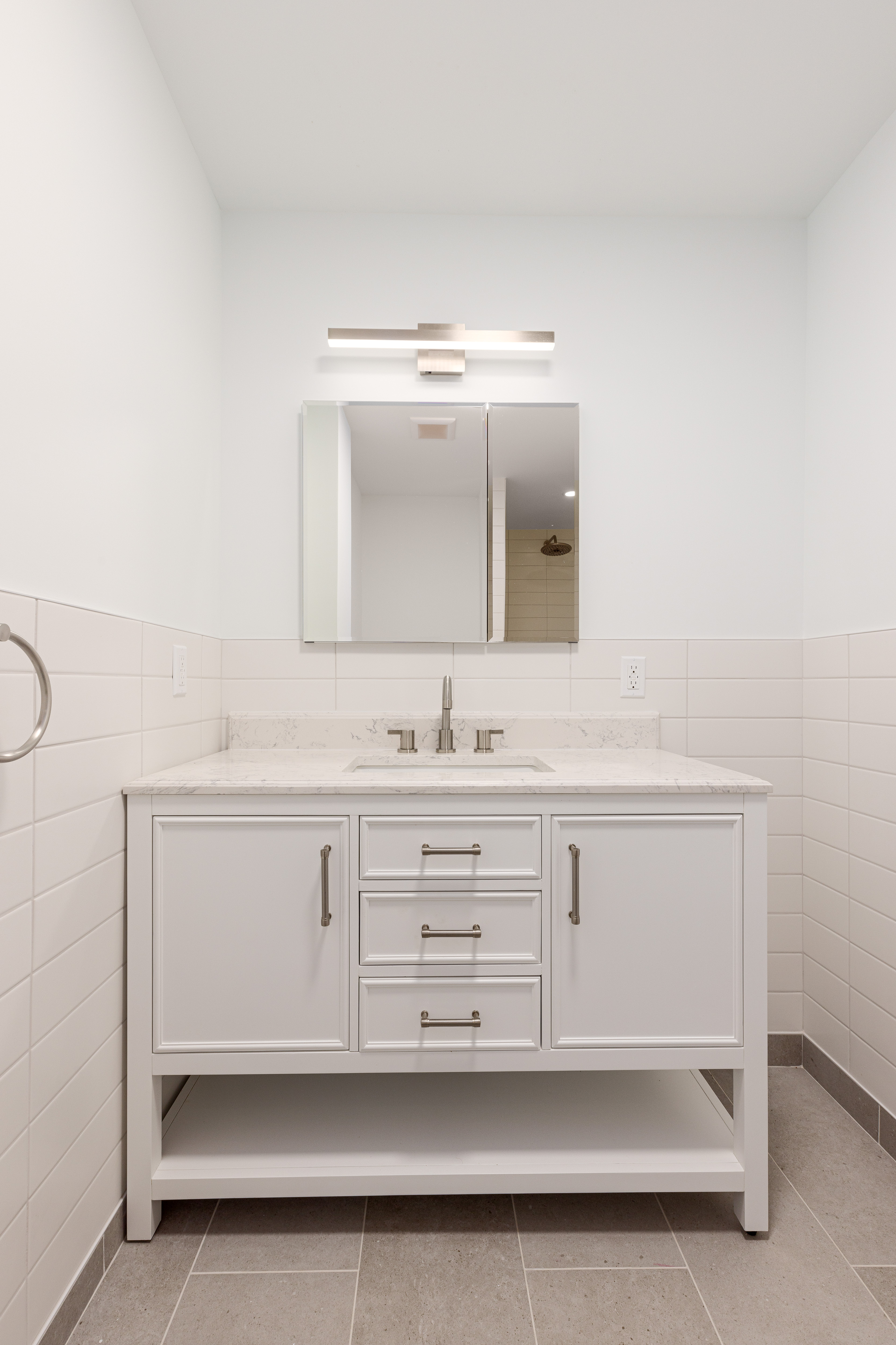 239 East 7th Street, Unit 1 Manhattan, NY 10009 - Photo 8 of 9 a bathroom with a sink vanity and mirror