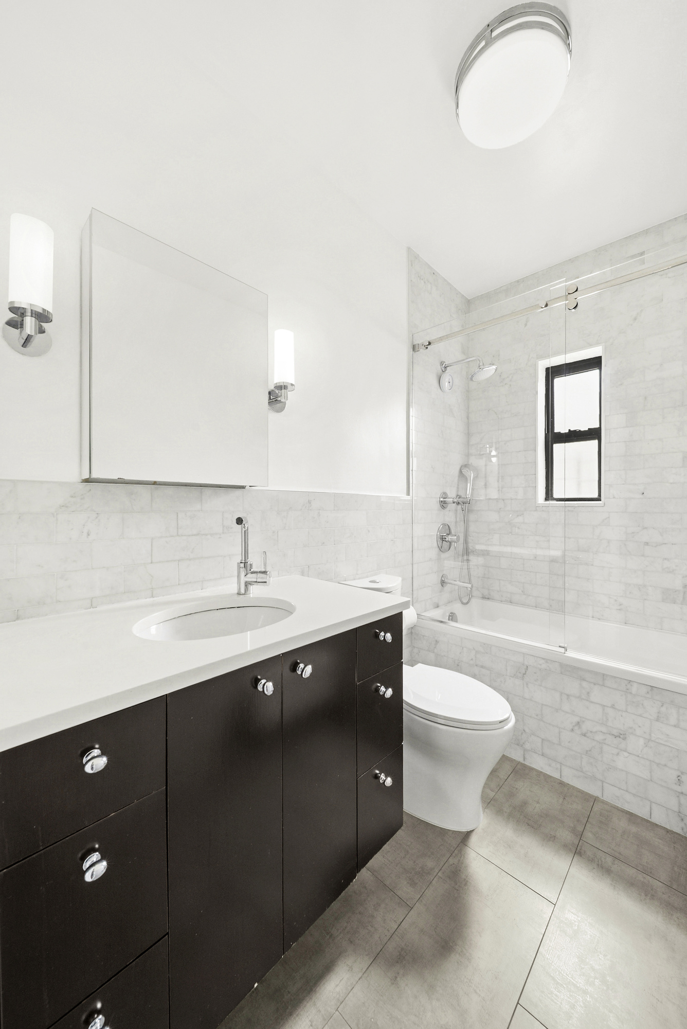 514 West End Avenue, Unit 14A Manhattan, NY 10024 - Photo 7 of 9 a bathroom with a sink a toilet and bathtub