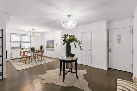 a view of a livingroom with furniture and a table
