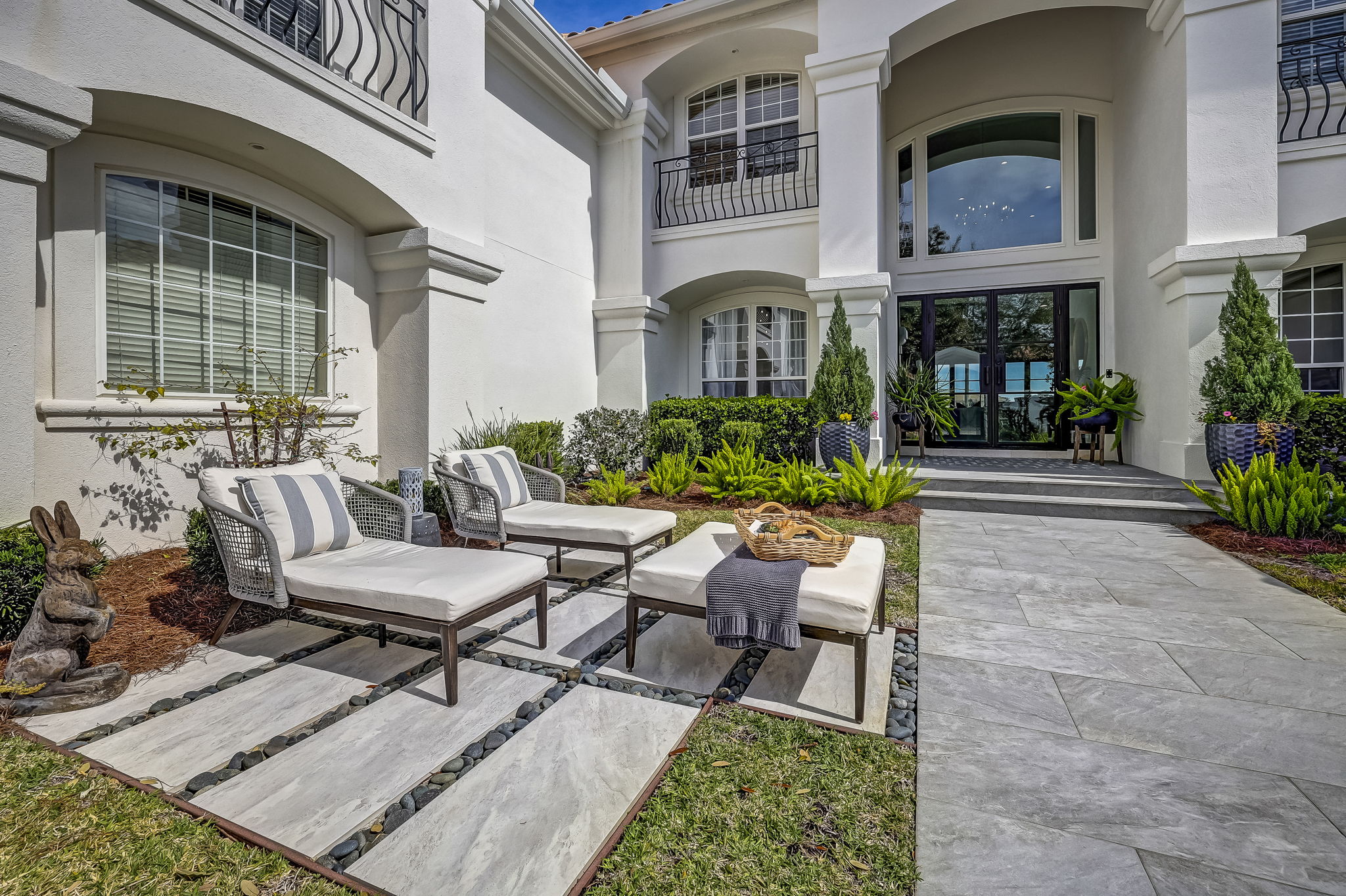 24624 Harbour View Drive Ponte Vedra Beach, FL 32082 - Photo 19 of 186 a view of a patio with couches table and chairs and potted plants