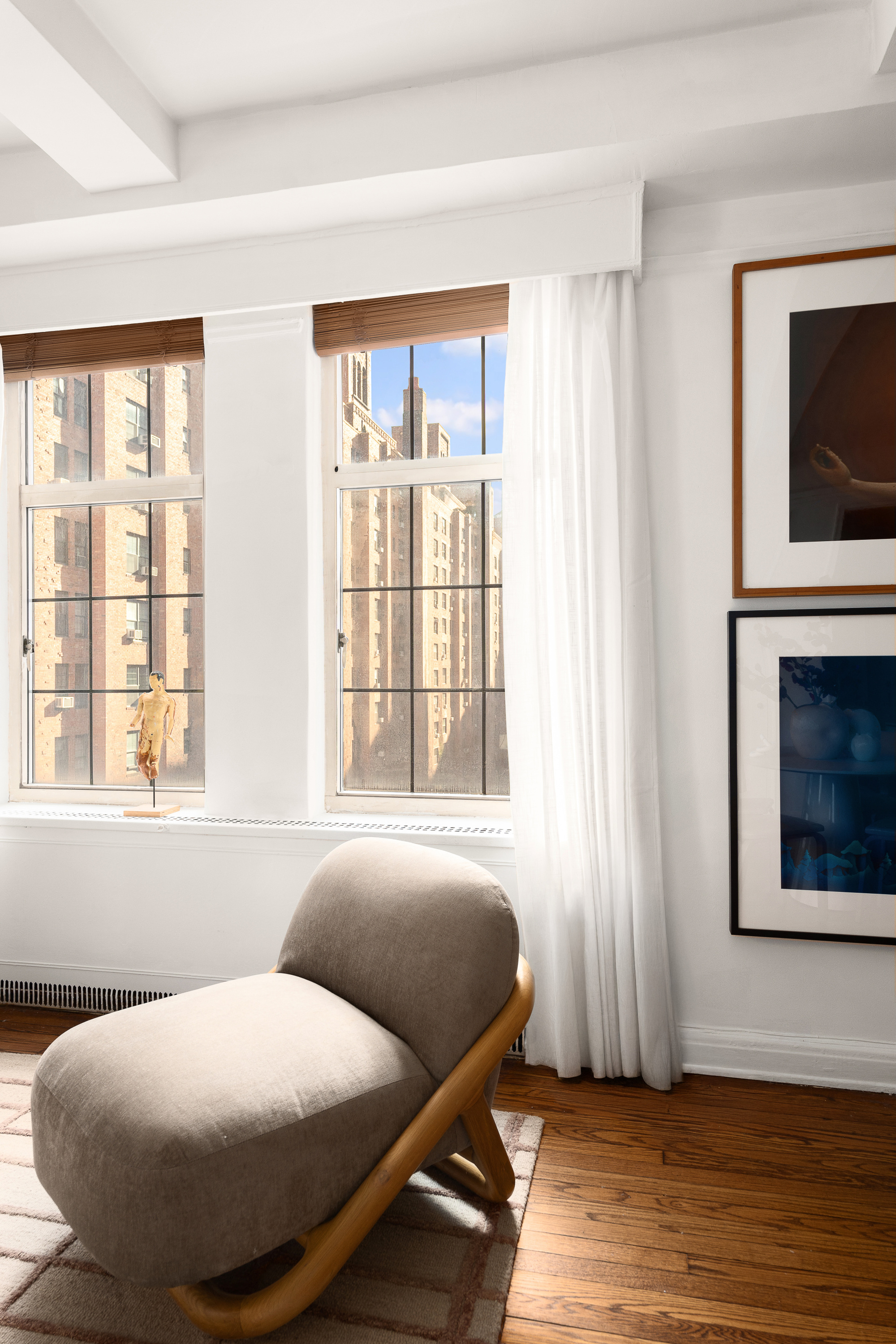 465 West 23rd Street, Unit 10A Manhattan, NY 10011 - Photo 7 of 12 a bedroom with a bed and wooden floor