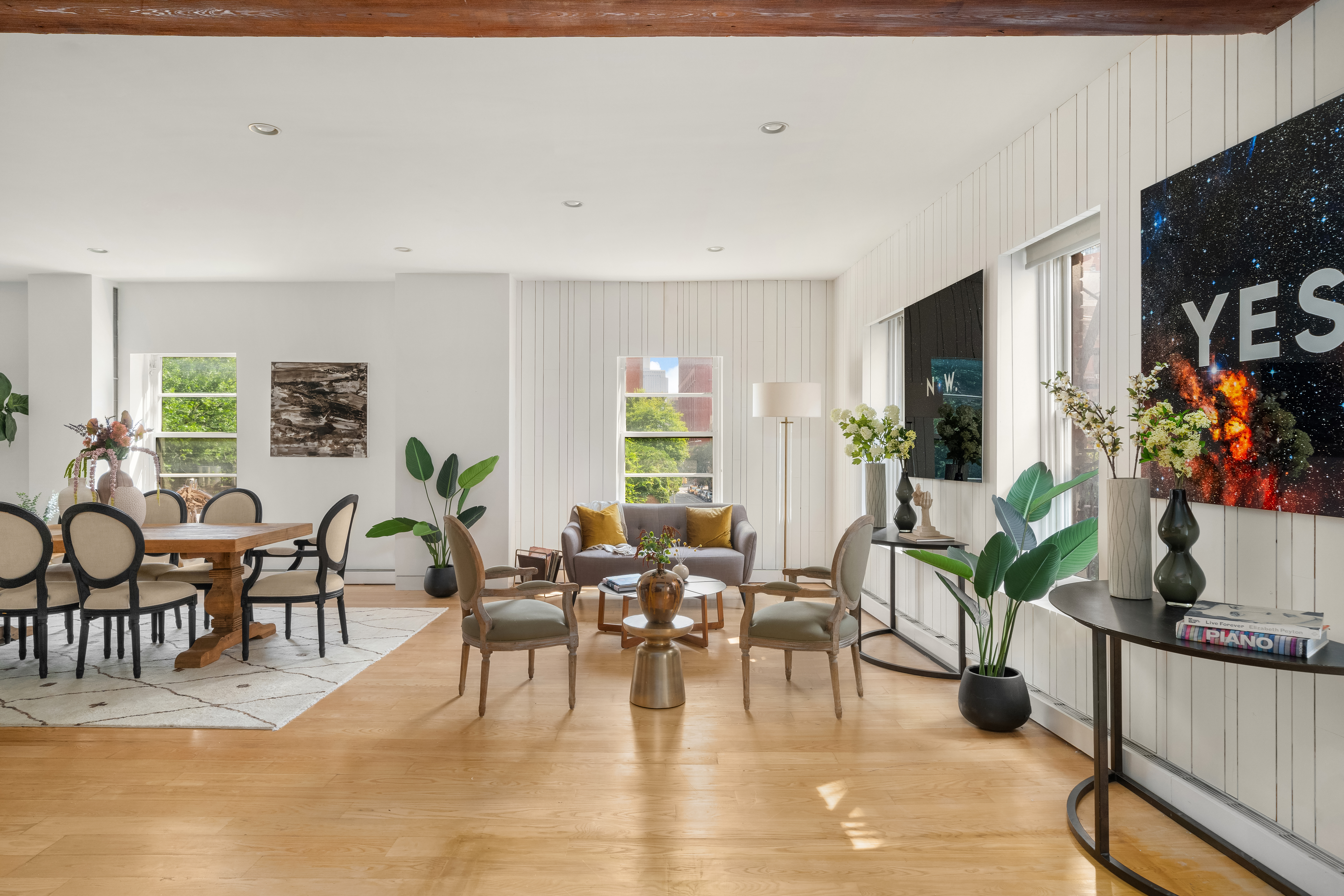 719 Greenwich Street, Unit 3S Manhattan, NY 10014 - Photo 2 of 21 a living room with furniture a potted plant and a large window