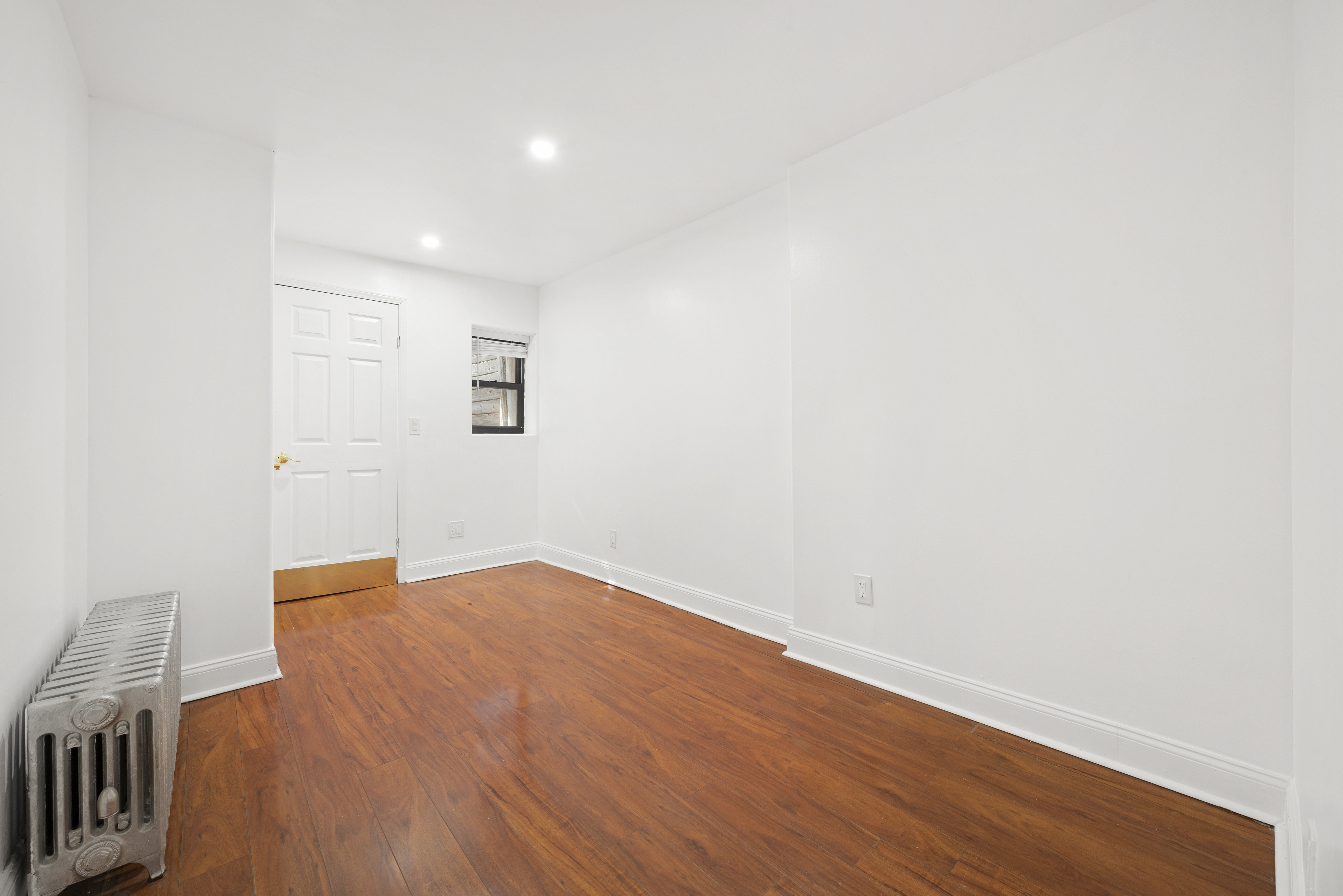 654 Lafayette Avenue, Unit GARDENA Brooklyn, NY 11216 - Photo 7 of 14 a view of an empty room with wooden floor