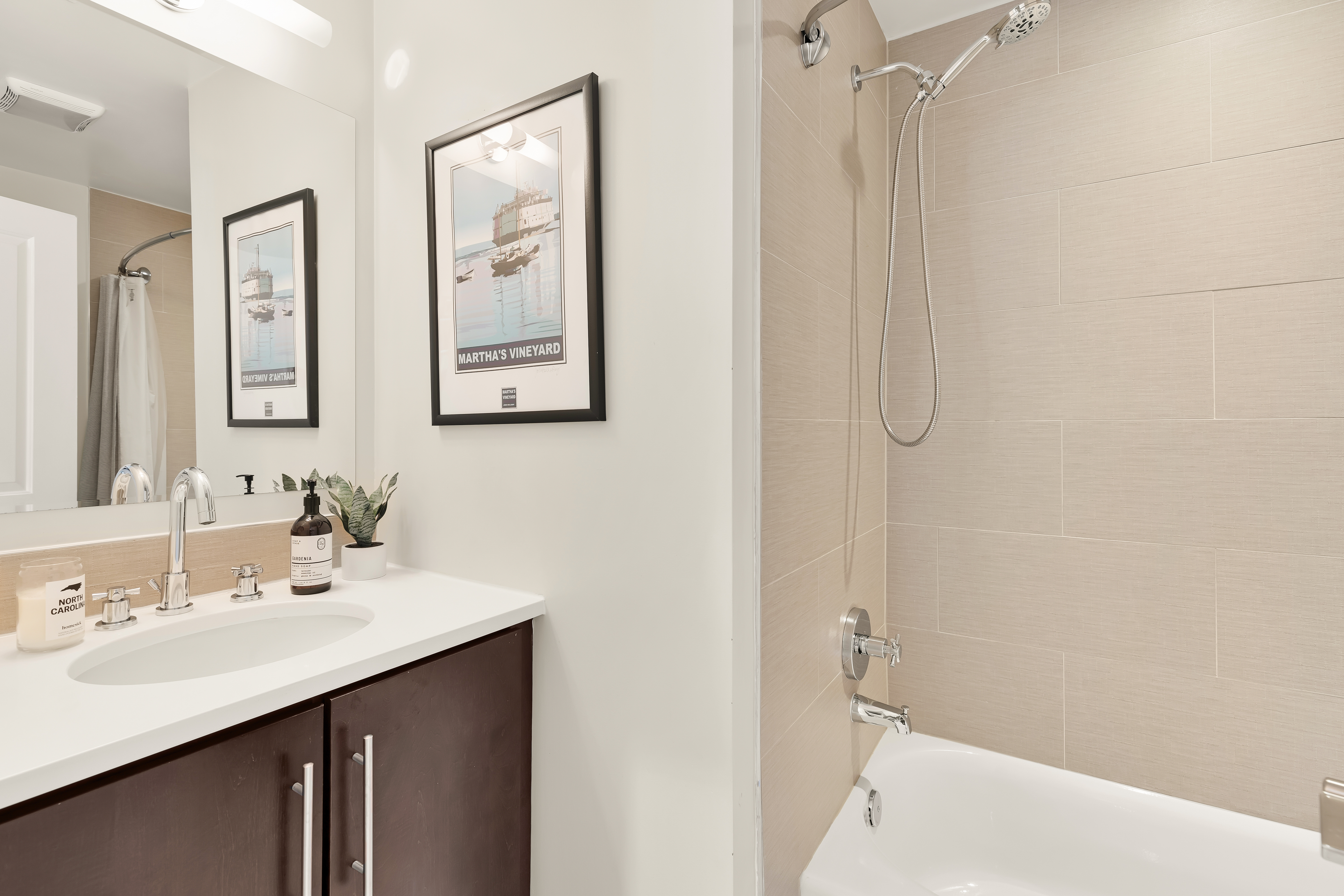 2101 11th Street Northwest, Unit 403 Washington, DC 20001 - Photo 17 of 30 a bathroom with a sink mirror and a shower