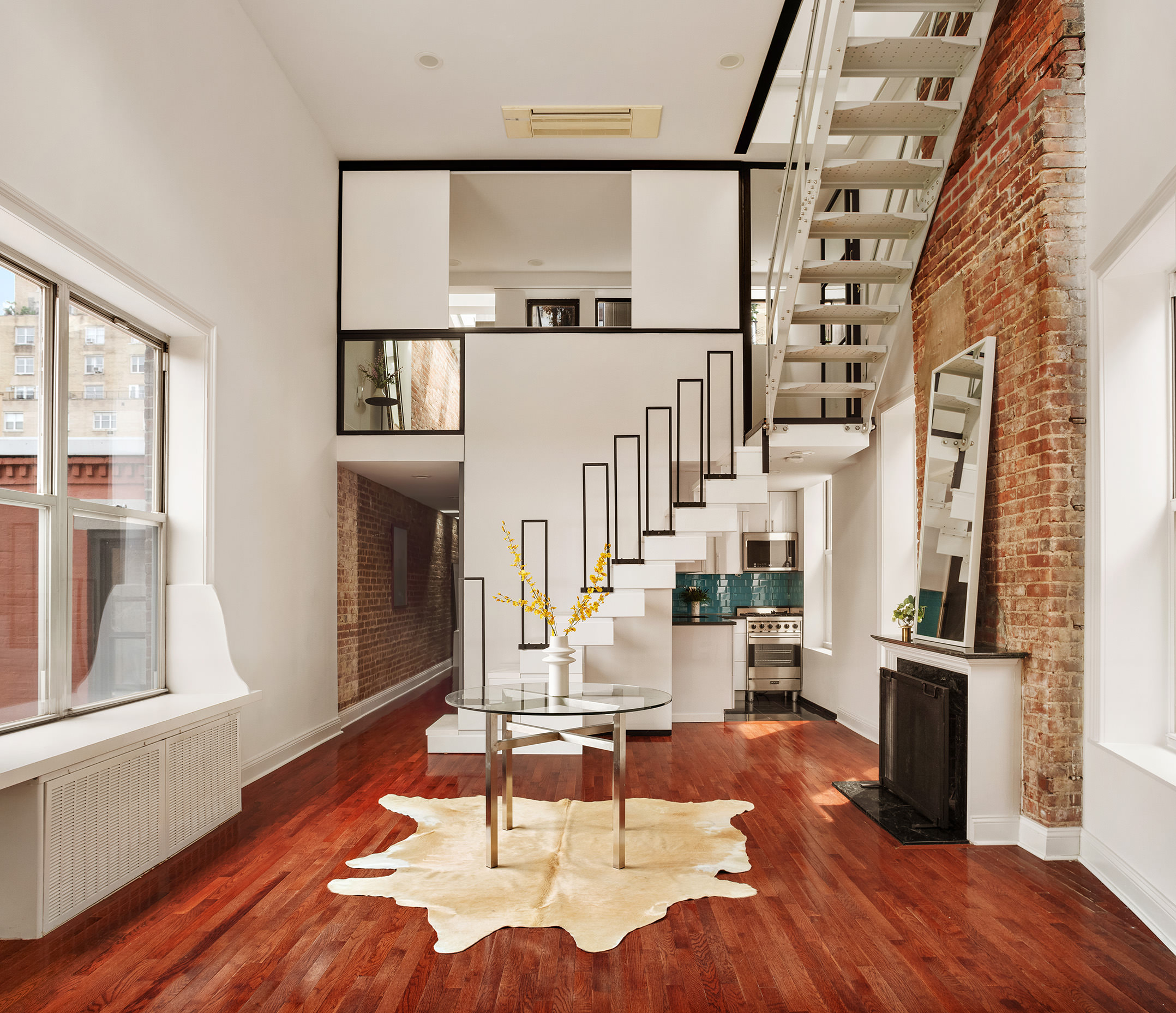 151 West 80th Street, Unit 5R Manhattan, NY 10024 - Photo 3 of 10 a living room with furniture a fireplace and wooden floor