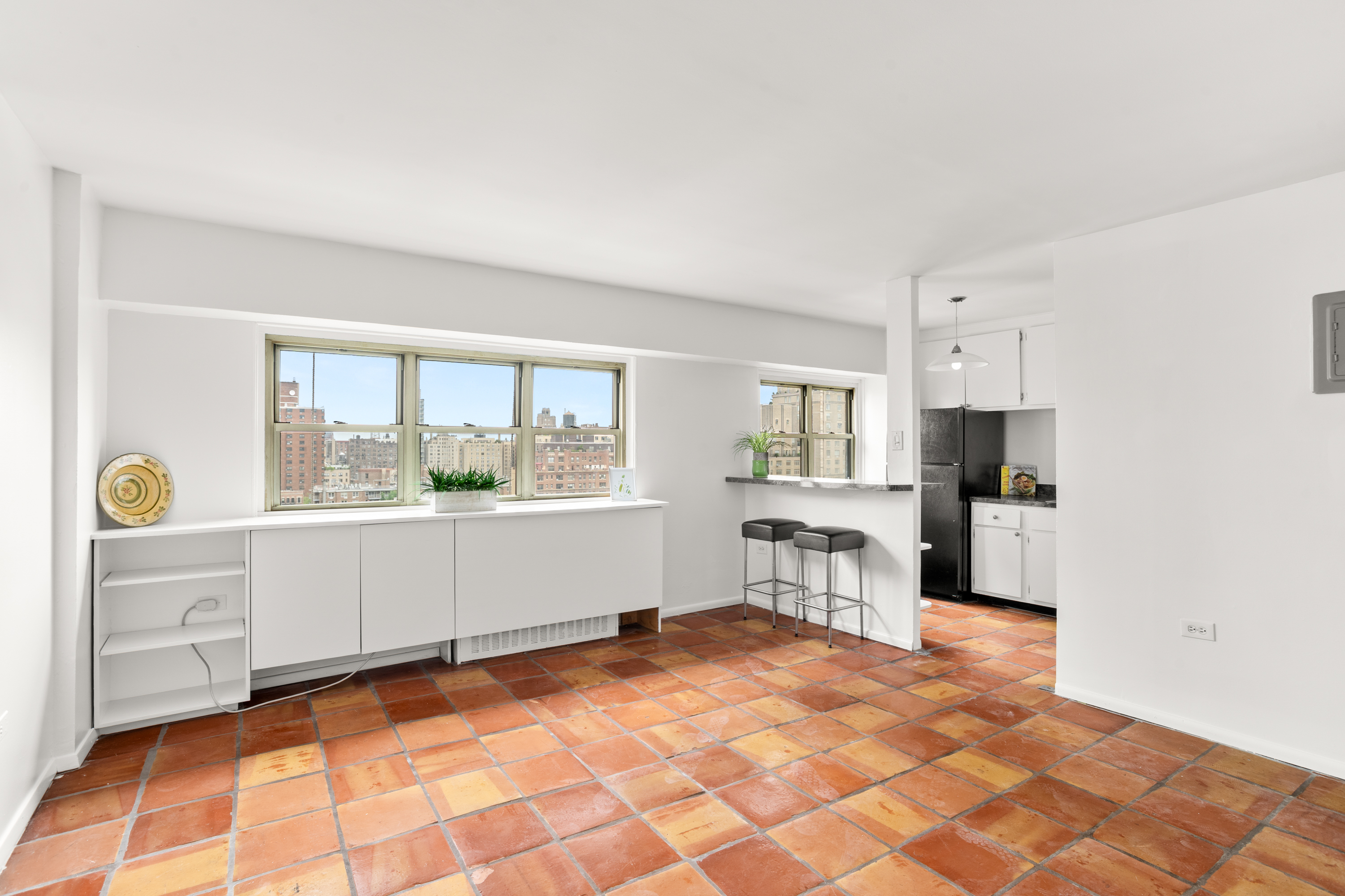 609 Columbus Avenue, Unit 14E Manhattan, NY 10024 - Photo 2 of 24 a room with a computer on the desk and a window