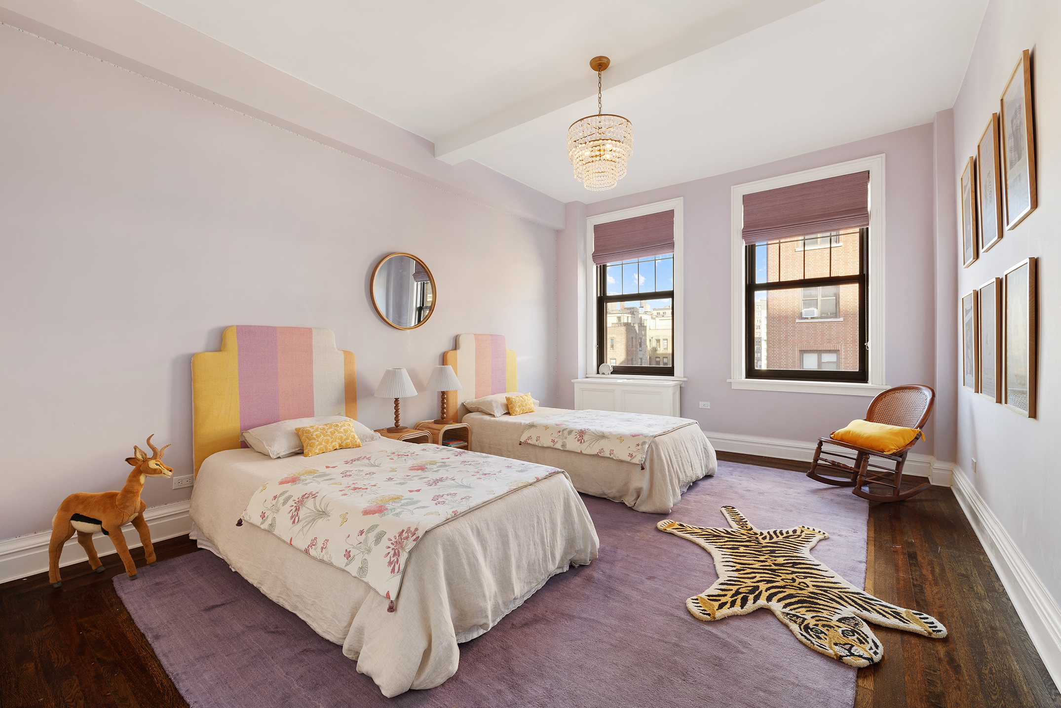 24 West 69th Street, Unit 9A Manhattan, NY 10023 - Photo 10 of 14 a bedroom with bed couch and window