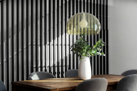 a living room with furniture fireplace and a table