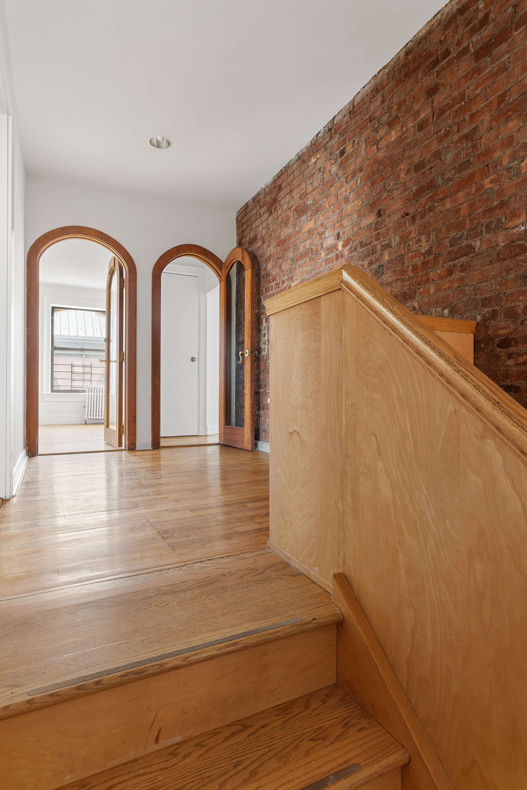 295 East 8th Street, Unit 2/3E Manhattan, NY 10009 - Photo 14 of 23 a view of a livingroom with wooden floor