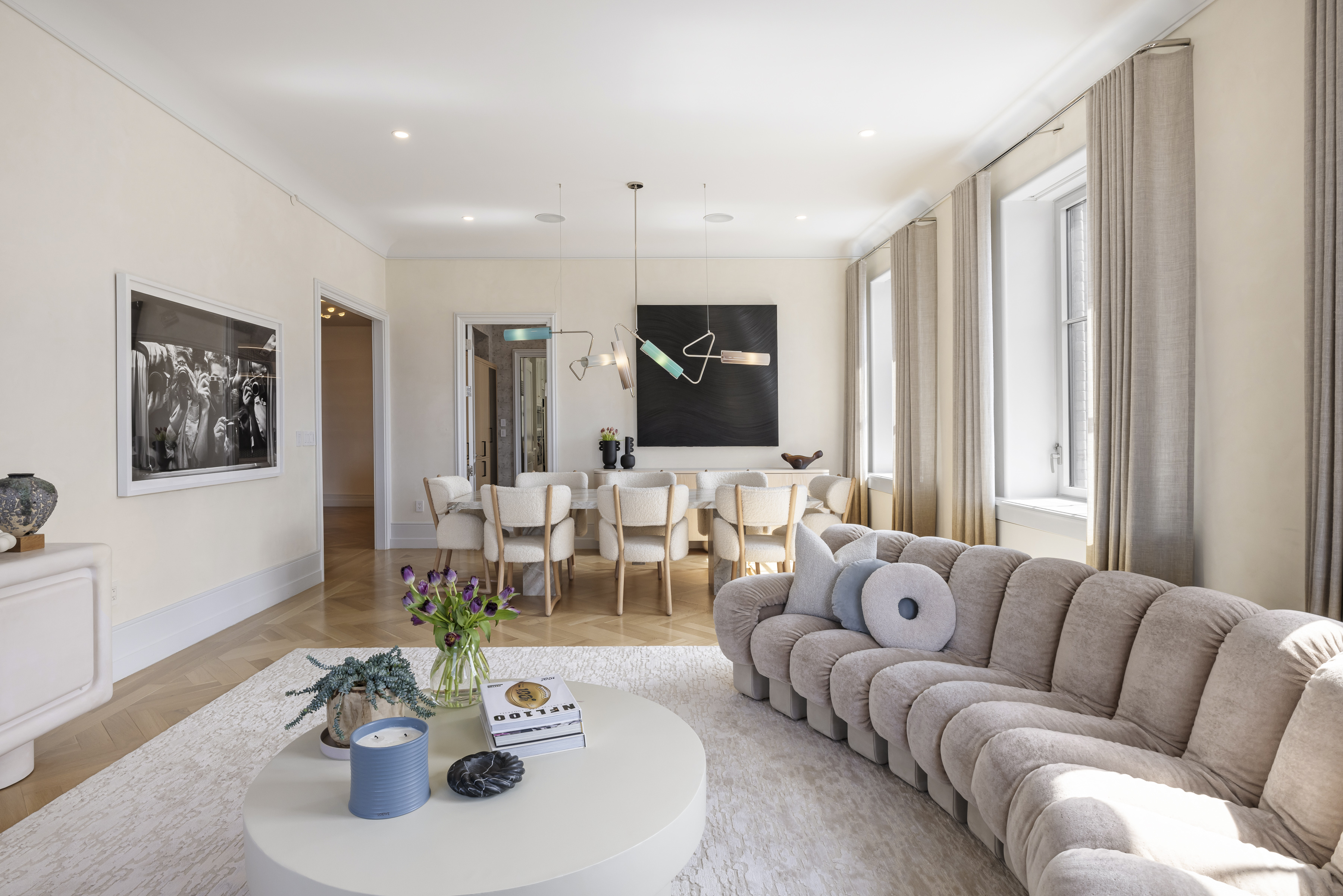 301 East 80th Street, Unit 25B Manhattan, NY 10075 - Photo 4 of 38 a living room with furniture and a large window