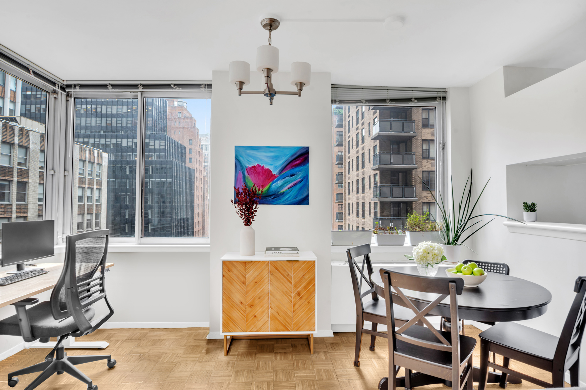 235 East 40th Street, Unit 11G Manhattan, NY 10016 - Photo 3 of 20 a living room with furniture and a floor to ceiling window