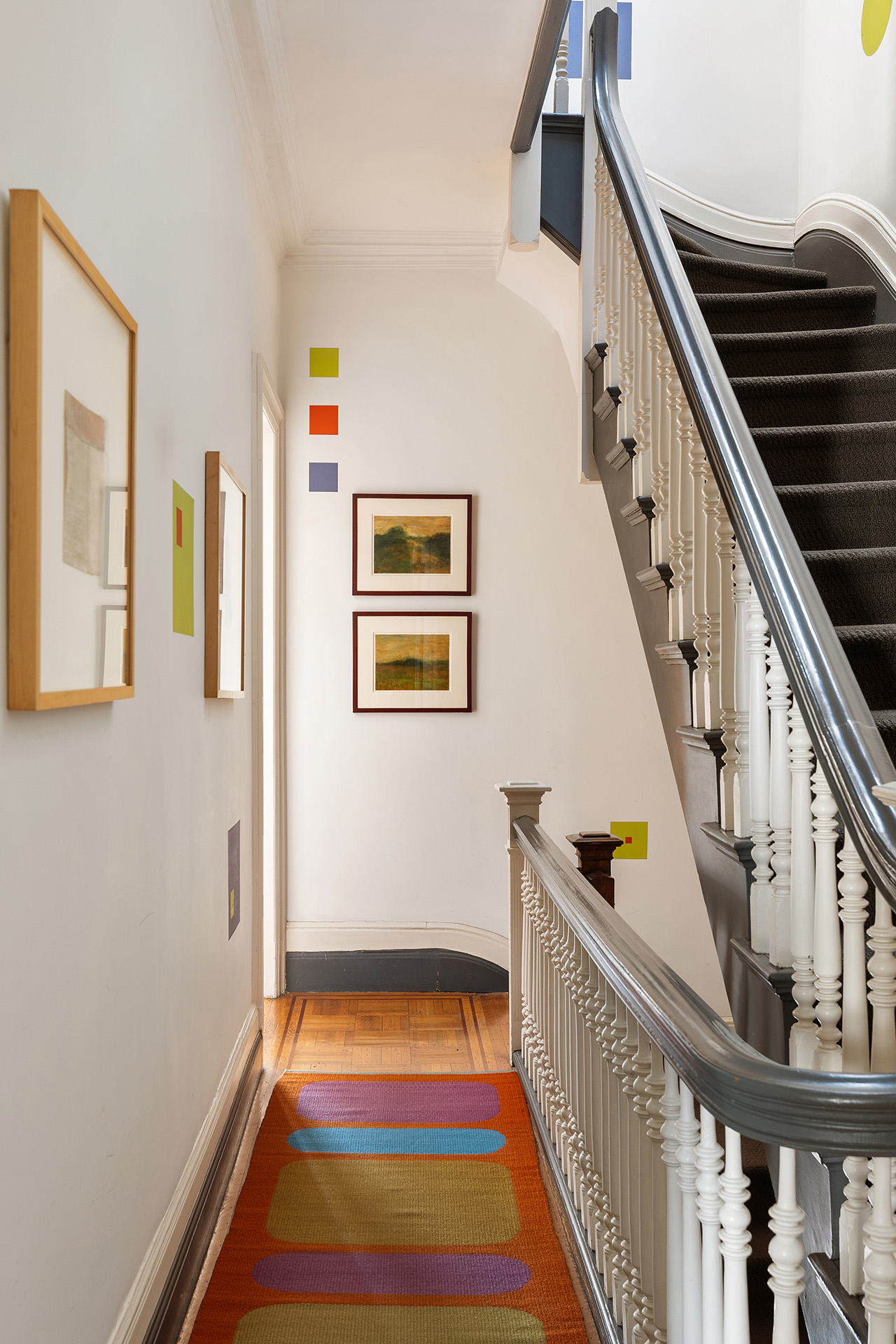 323 Garfield Place Brooklyn, NY 11215 - Photo 10 of 14 a room with lots of white furniture and wooden floor