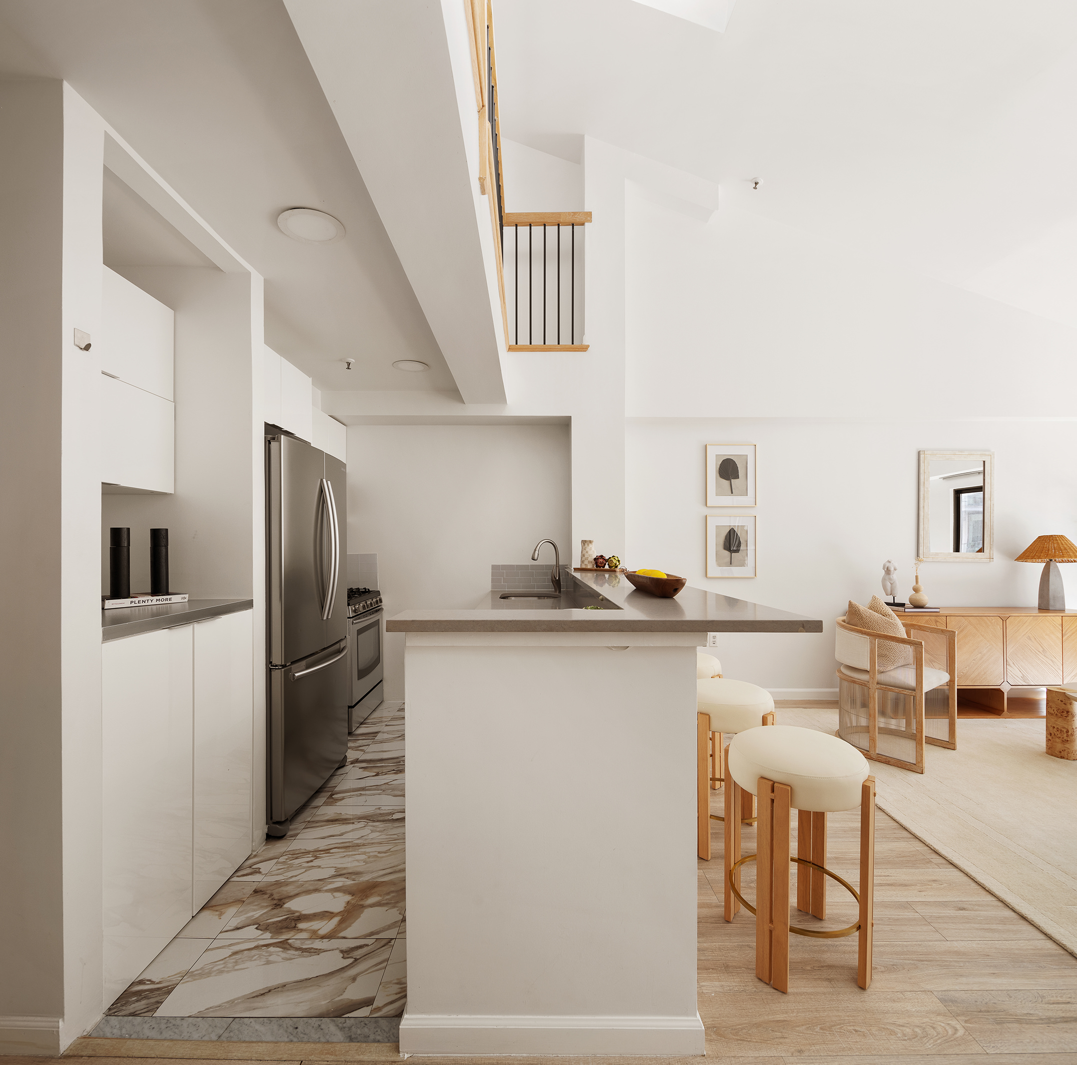 136-140 West 23rd Street, Unit PHD Manhattan, NY 10011 - Photo 8 of 15 a kitchen with cabinets and refrigerator