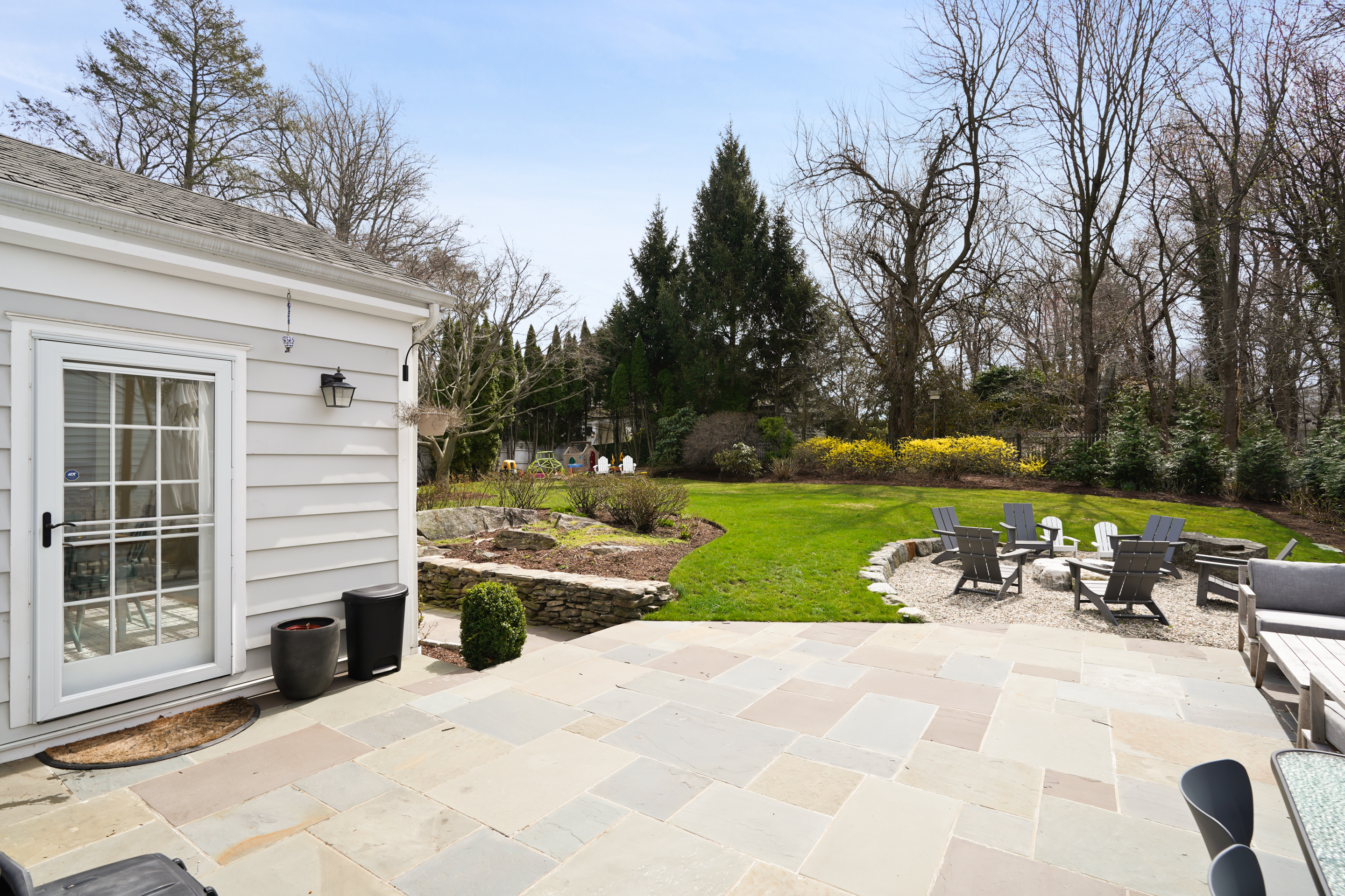 15 Anderson Road Greenwich, CT 06830 - Photo 23 of 30 a view of a house with backyard and sitting area