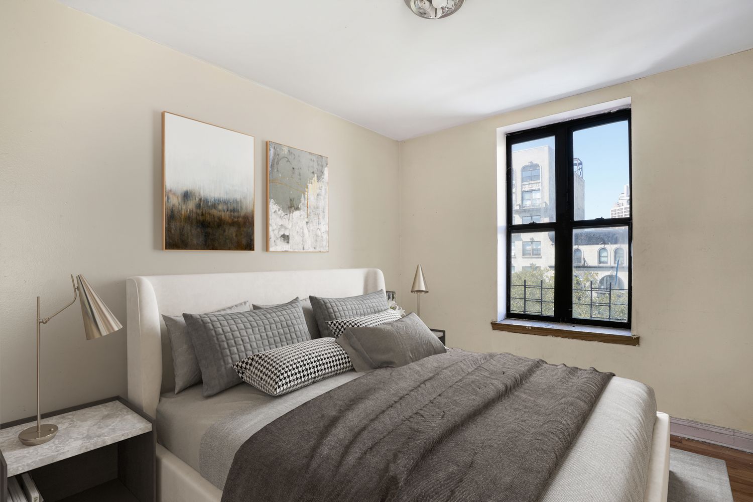 a bedroom with a bed and a window