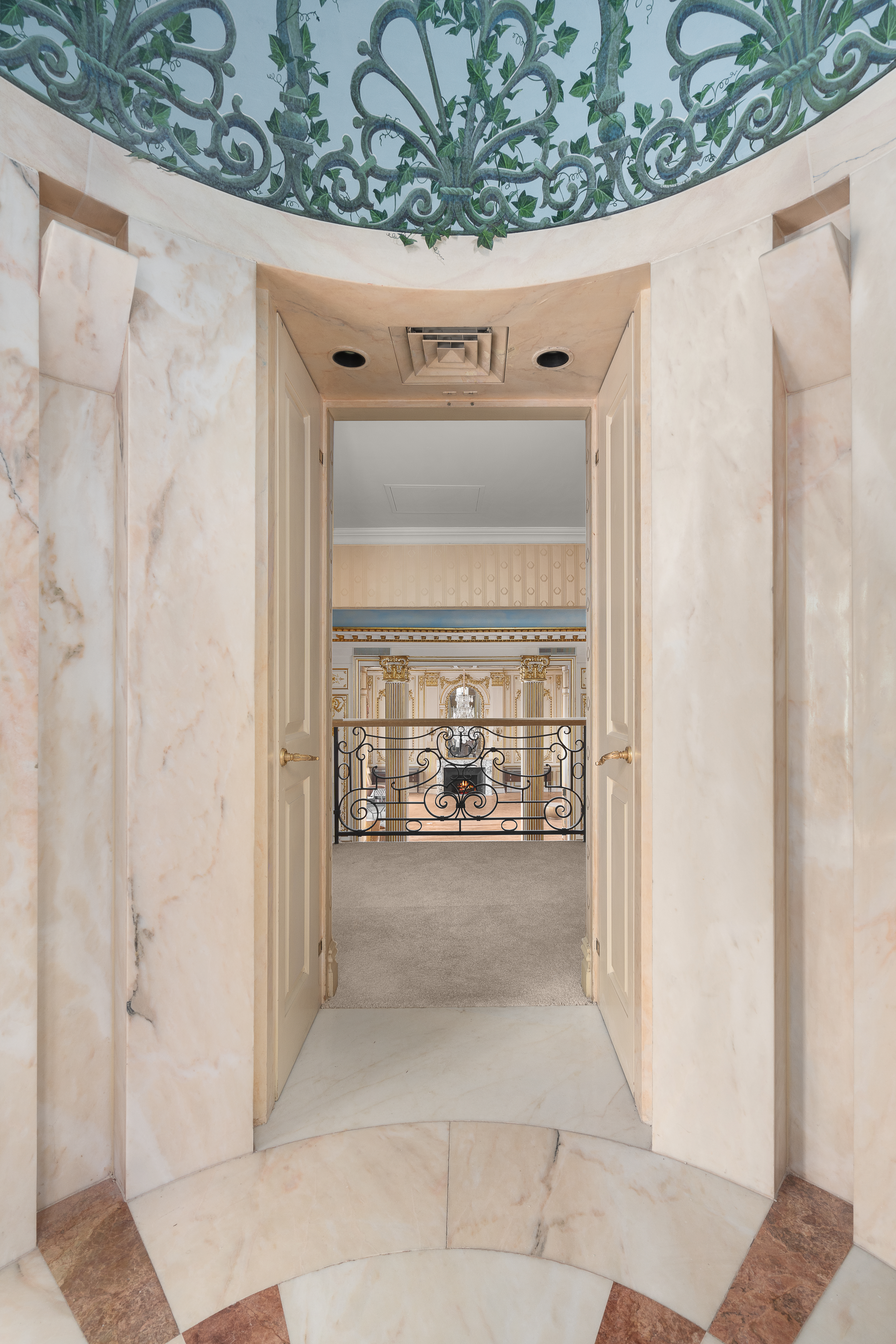 1 East 62nd Street, Unit PH Manhattan, NY 10065 - Photo 10 of 13 a view of a hallway with a dining table and chairs