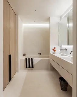 a bathroom with a bathtub and a window