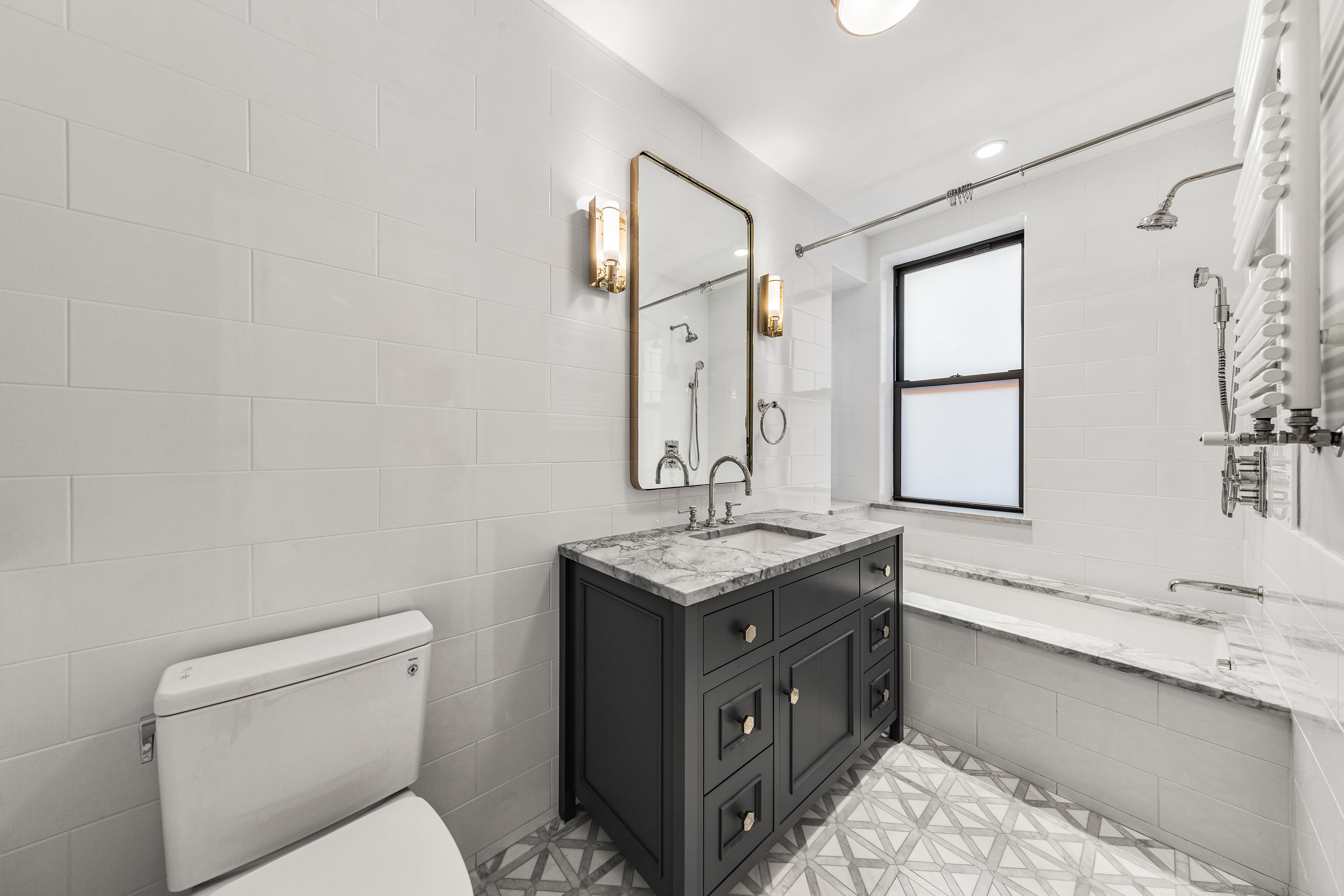 110 West 81st Street Manhattan, NY 10024 - Photo 16 of 30 a bathroom with a granite countertop sink a toilet and mirror