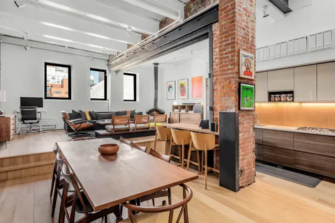 a kitchen with a table chairs and a stove