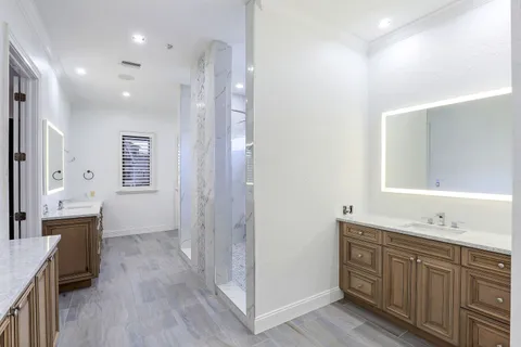 a white bath tub sitting next to a window
