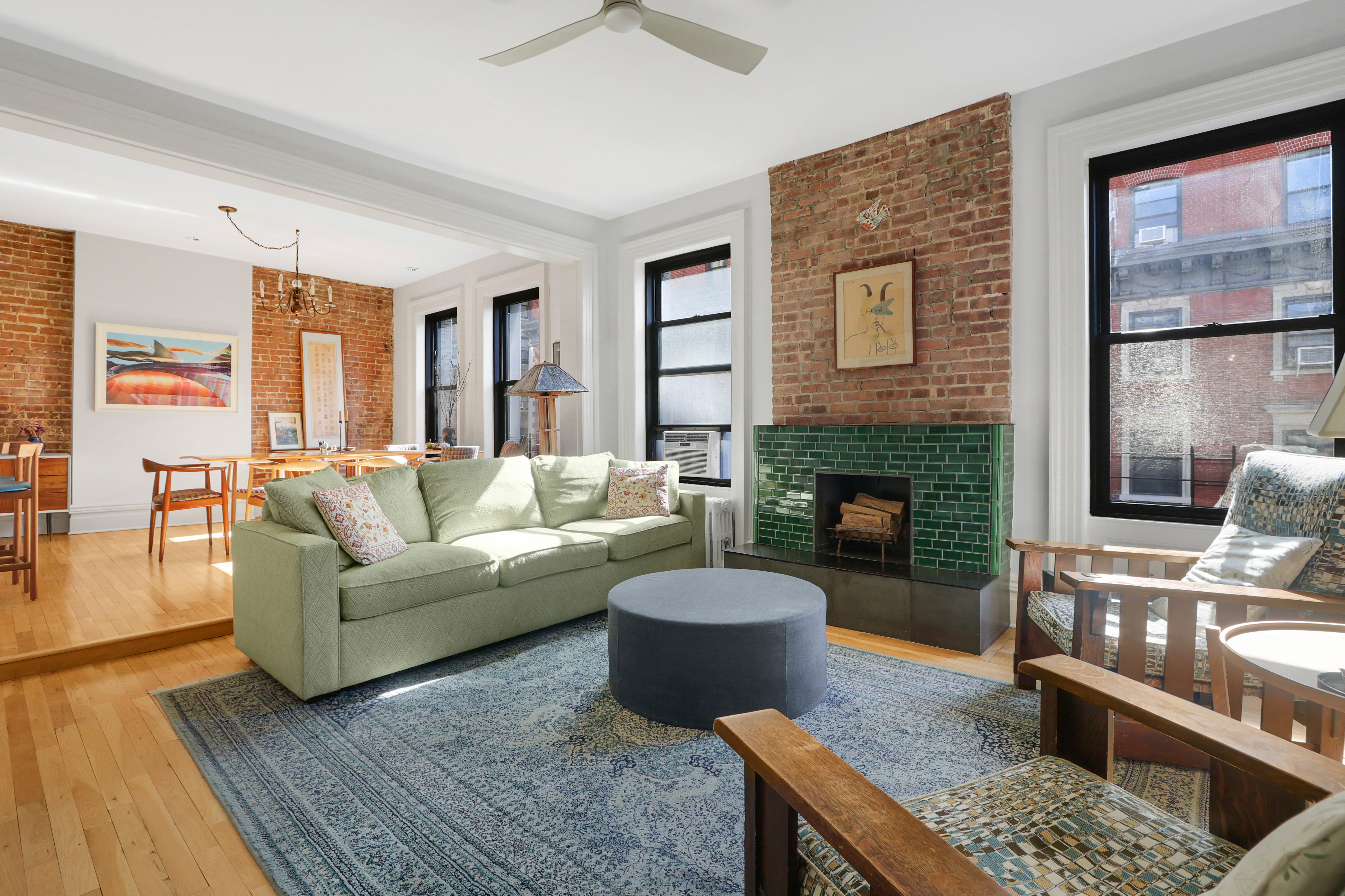 a living room with furniture and a fireplace