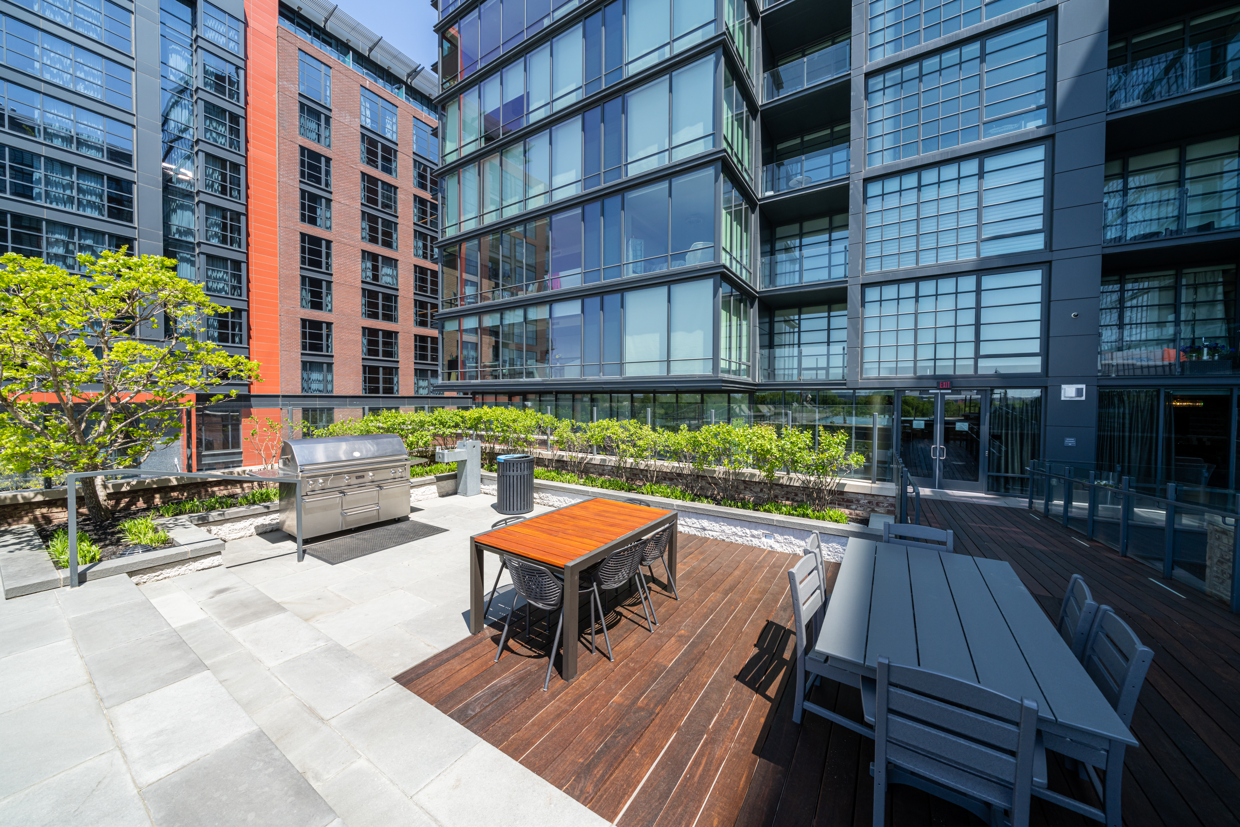 45 Sutton Square Southwest, Unit PH10 Washington, DC 20024 - Photo 37 of 44 a table and chairs sitting in front of a building