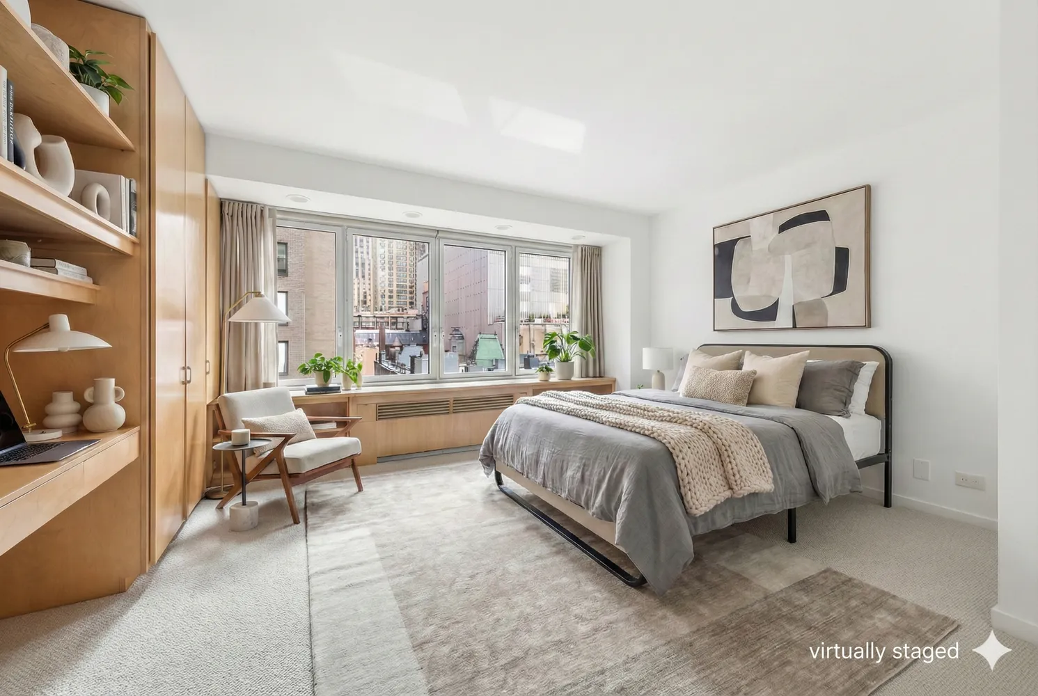 a spacious bedroom with a bed and large windows