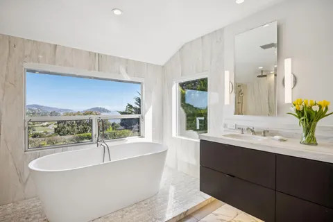 a bathroom with a bathtub and a sink