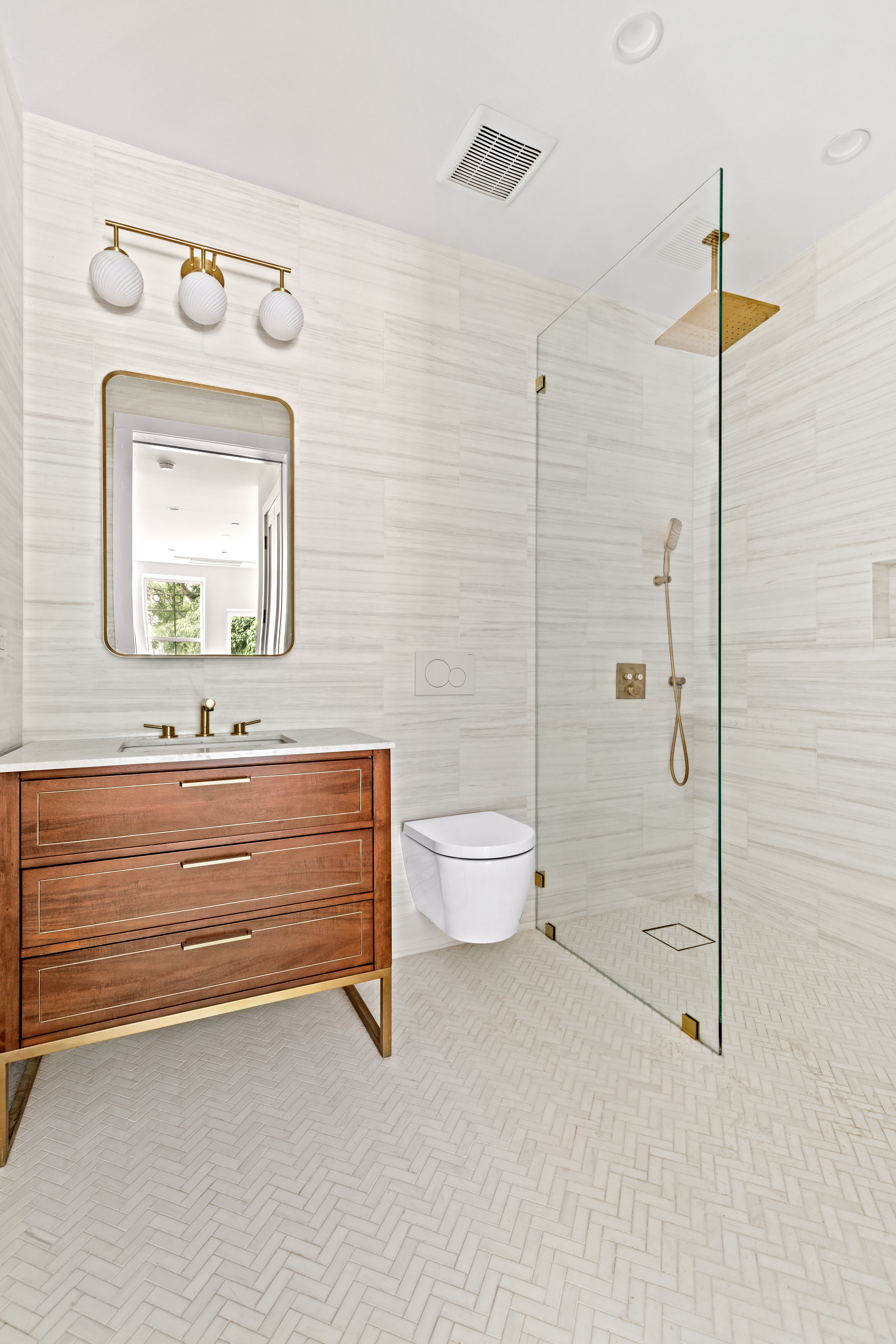 74 Carroll Street, Unit 2 Brooklyn, NY 11231 - Photo 7 of 13 a bathroom with a toilet sink and mirror