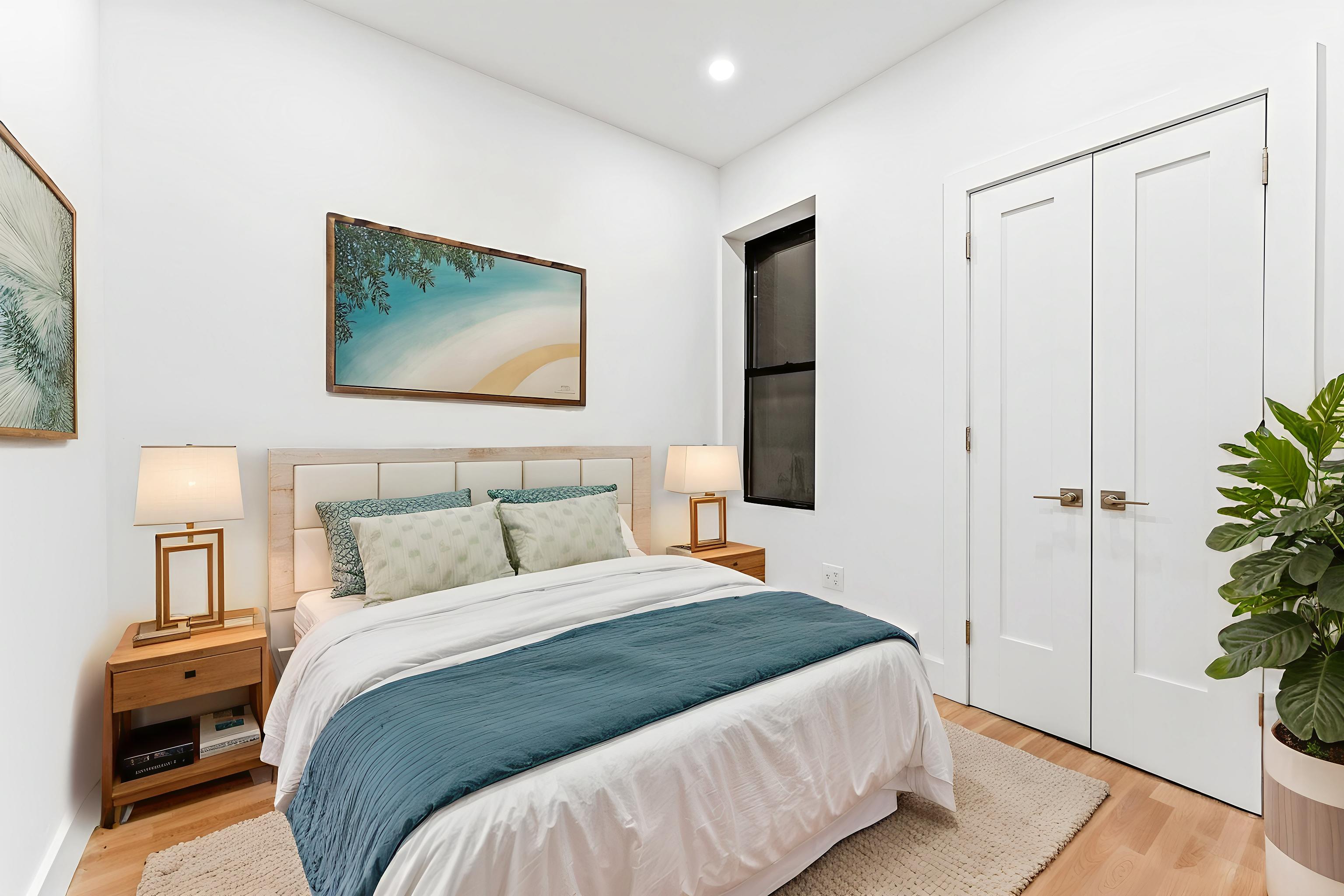 280 Suydam Street, Unit 2R Brooklyn, NY 11237 - Photo 4 of 6 a bedroom with a bed and a potted plant