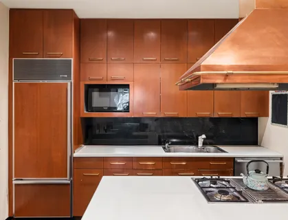 a kitchen with a refrigerator and a sink