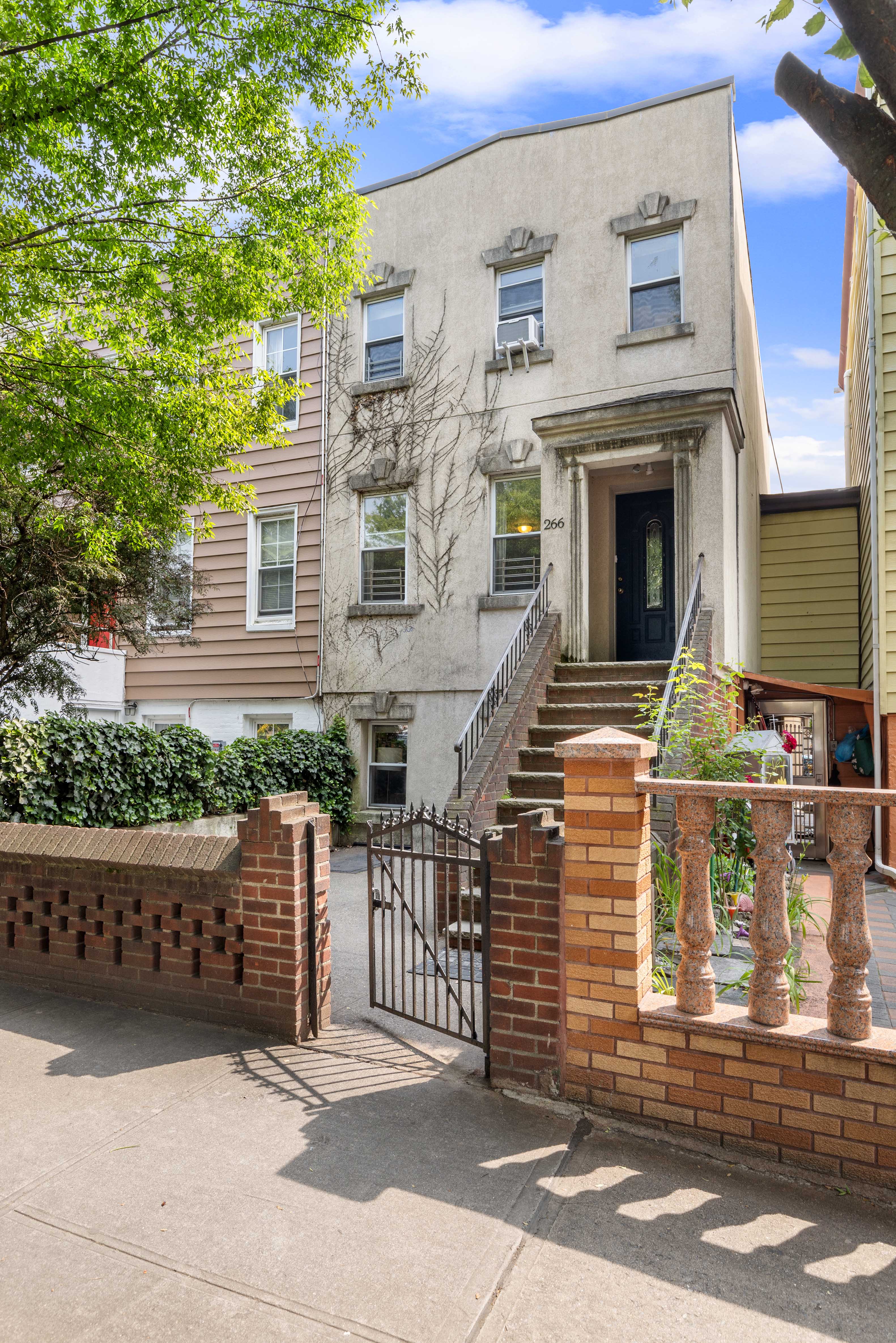 266 18th Street Brooklyn, NY 11215 - Photo 13 of 20 a front view of a house with stairs