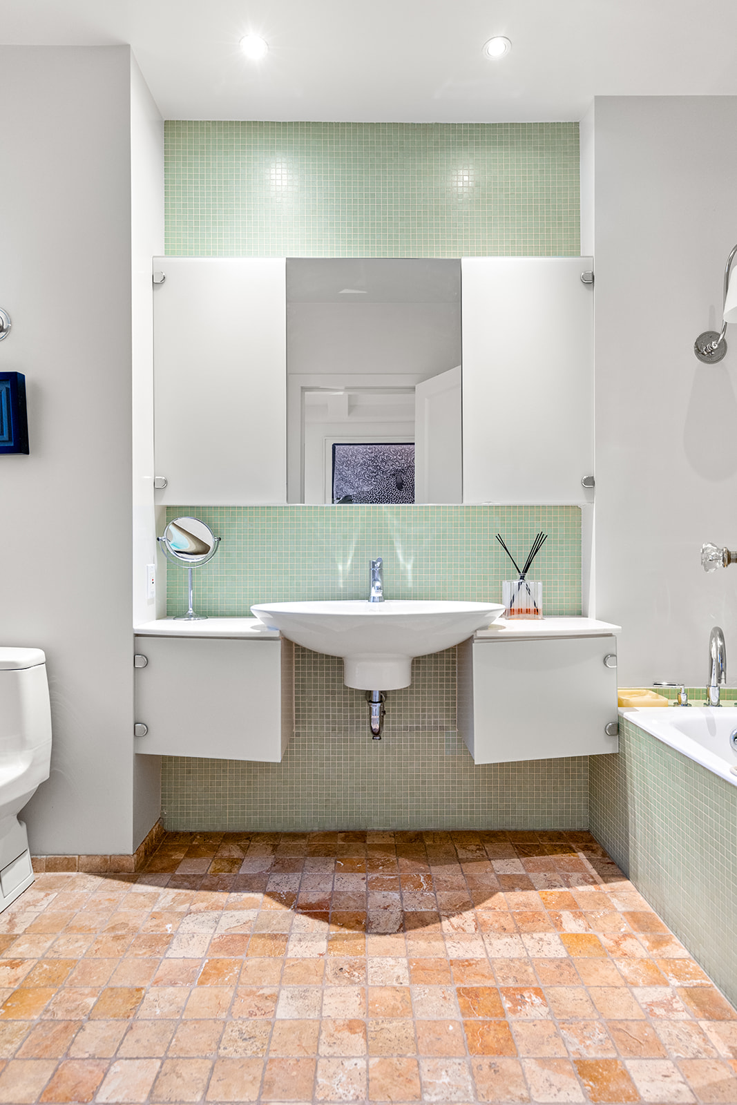 40 East 62nd Street, Unit 6E Manhattan, NY 10065 - Photo 19 of 25 a bathroom with a sink and a mirror