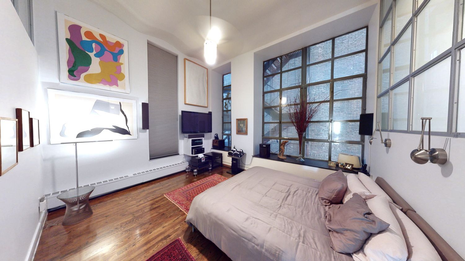 382 Lafayette Street, Unit 2 Manhattan, NY 10003 - Photo 8 of 19 a bedroom with a bed a dresser next to a window