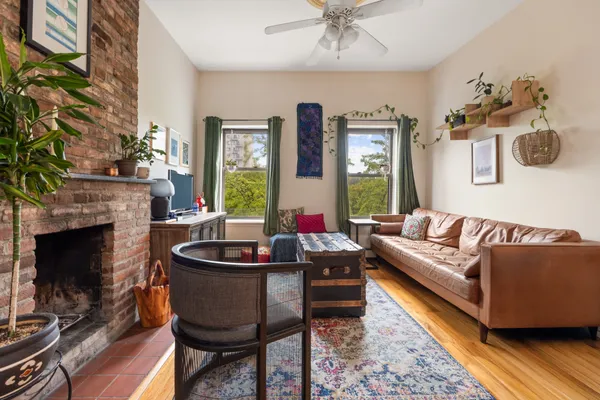 a living room with furniture and a fireplace