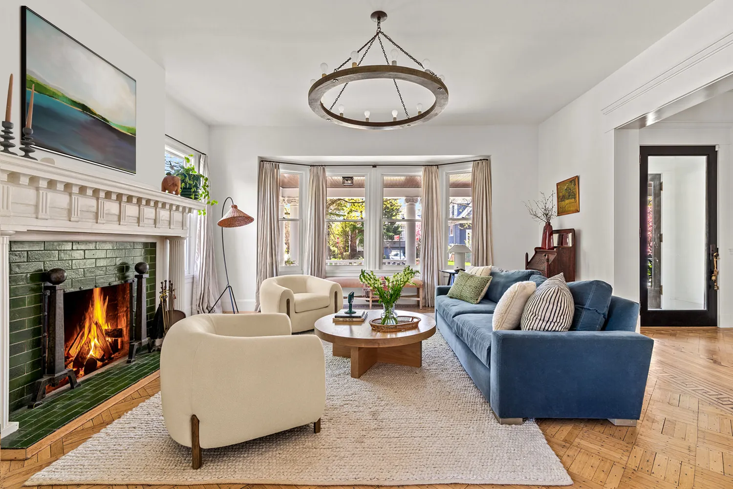 a living room with furniture a fireplace and a flat screen tv