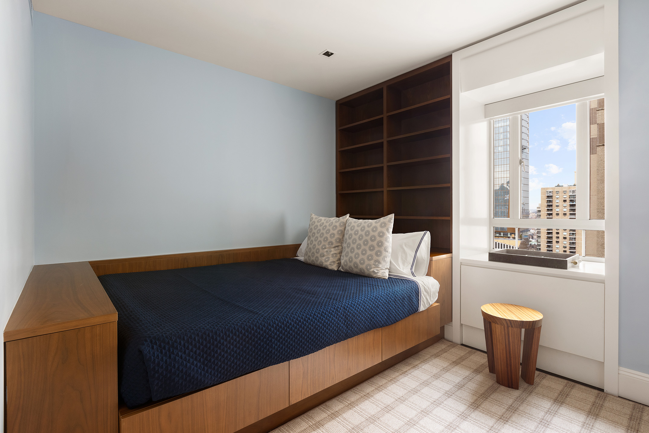 25 Central Park West, Unit 27J Manhattan, NY 10023 - Photo 10 of 13 a bed sitting in a bedroom next to a window
