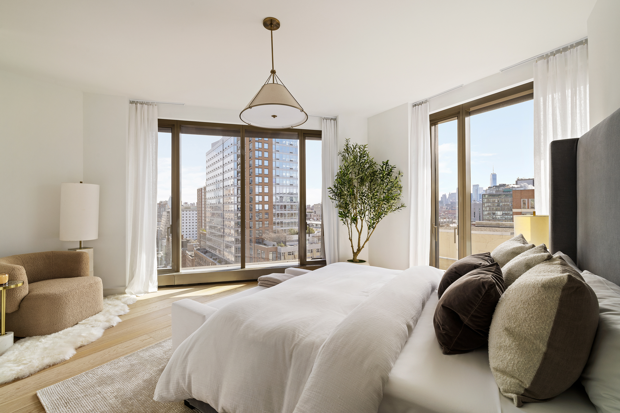500 West 18th Street, Unit EAST 15G Manhattan, NY 10011 - Photo 5 of 26 a bedroom with a bed and a large window