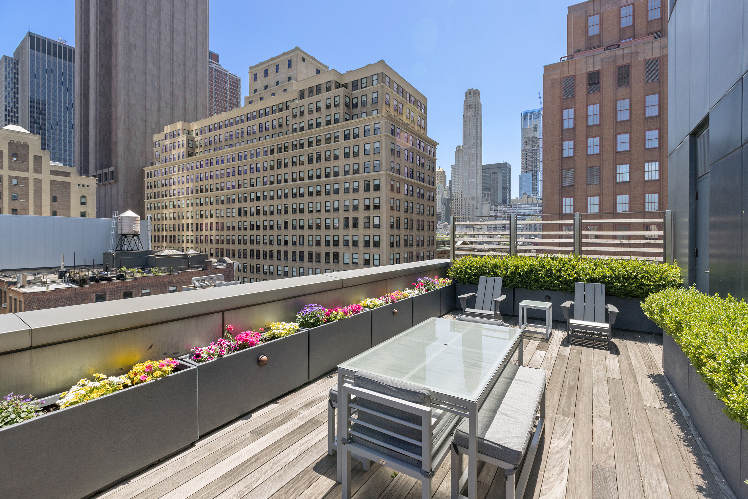 34 Leonard Street, Unit PH Manhattan, NY 10013 - Photo 28 of 30 a view of balcony with a table and chairs