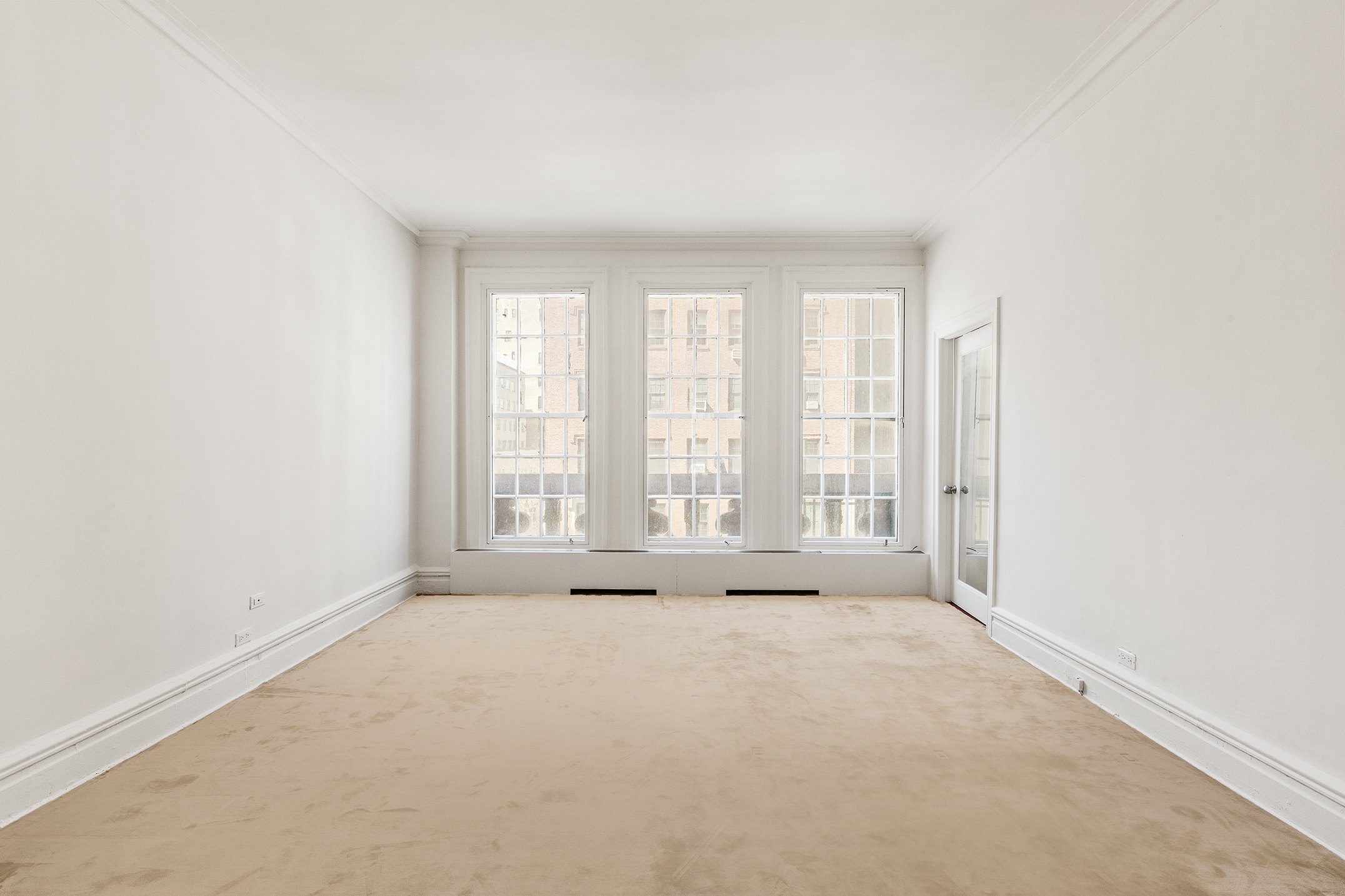 45 East 66th Street, Unit 4NW Manhattan, NY 10065 - Photo 16 of 29 a view of an empty room with a window